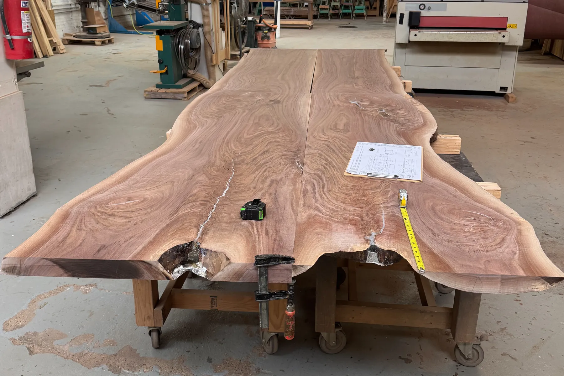 custom bookmatch slab tables by Icon Modern