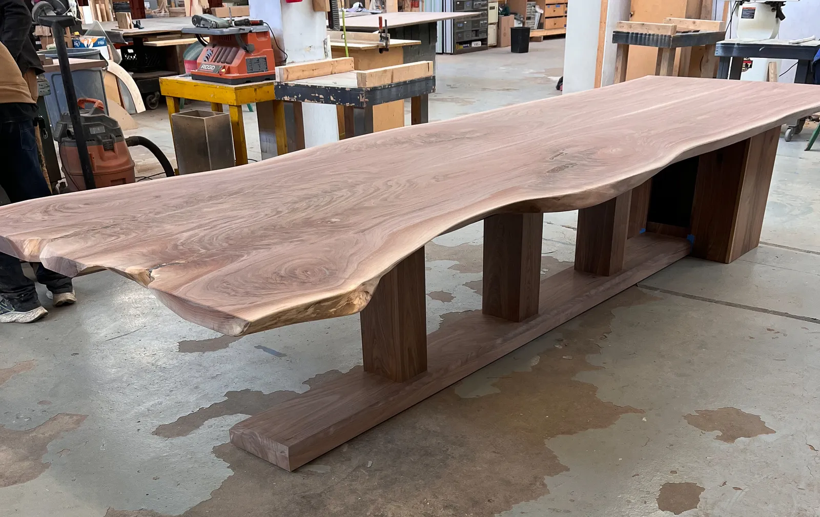 Custom walnut live edge conference table by Icon Modern