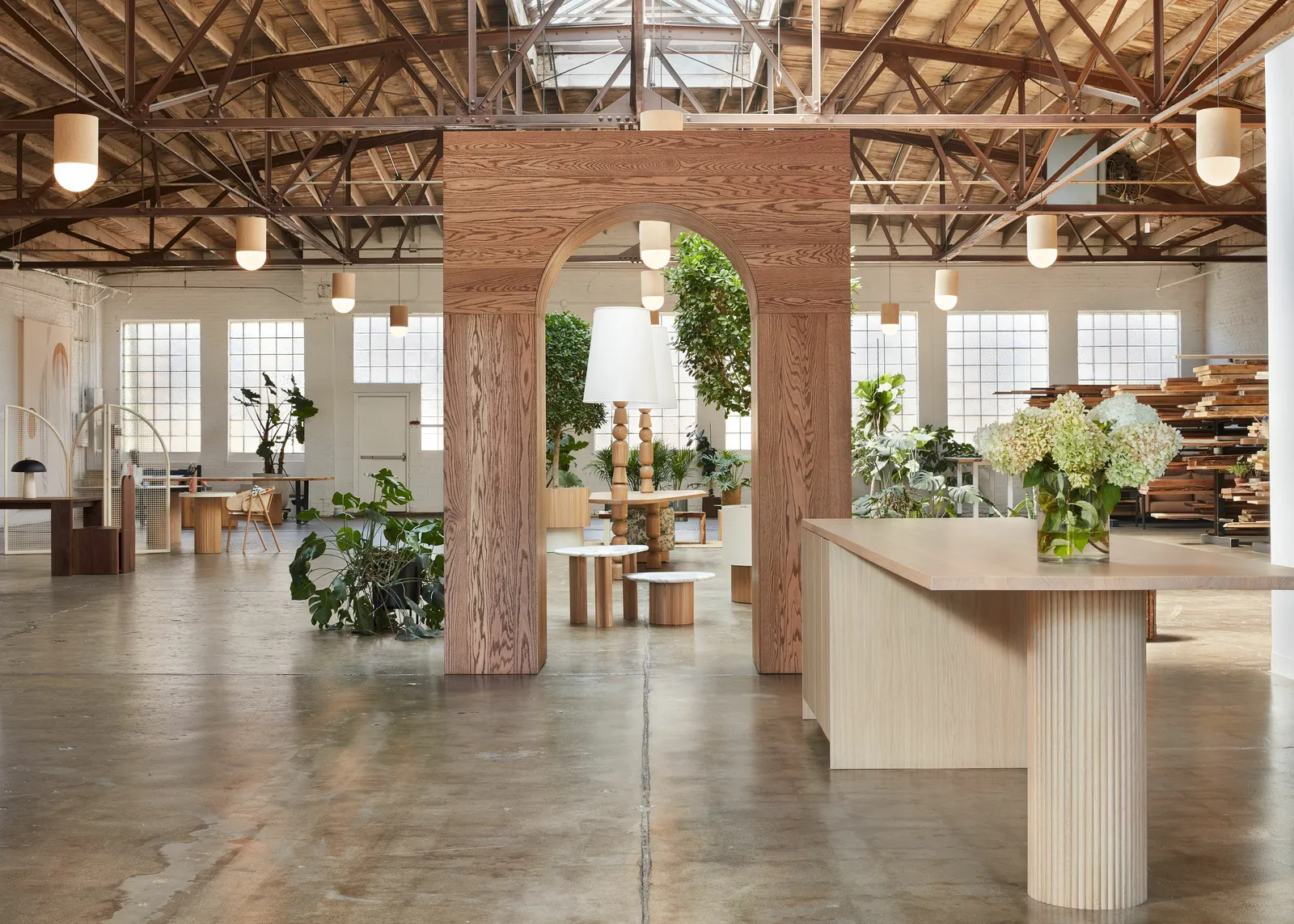 custom arched space divider in urban ash and custom stain by Icon Modern