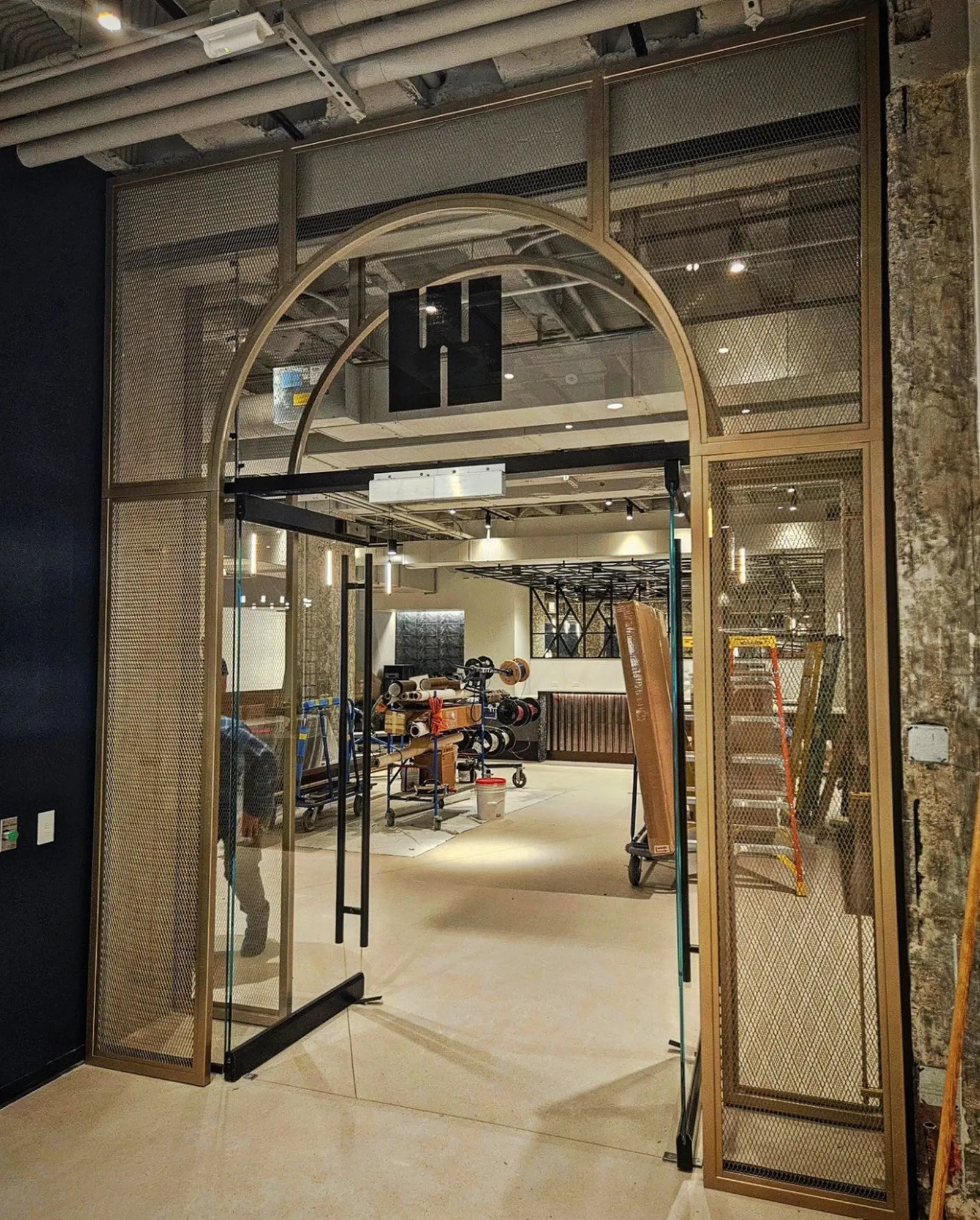 custom steel space divider in arch shape by Icon Modern