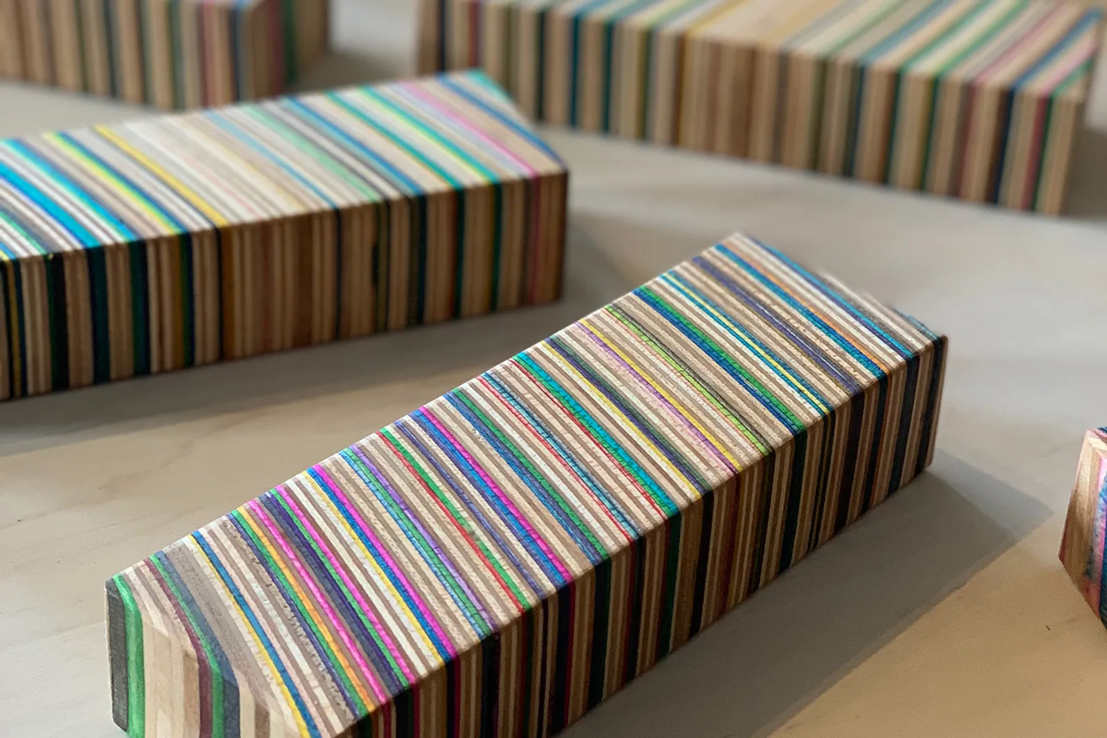 Recycled materials blocks of wood glued together and then cut.