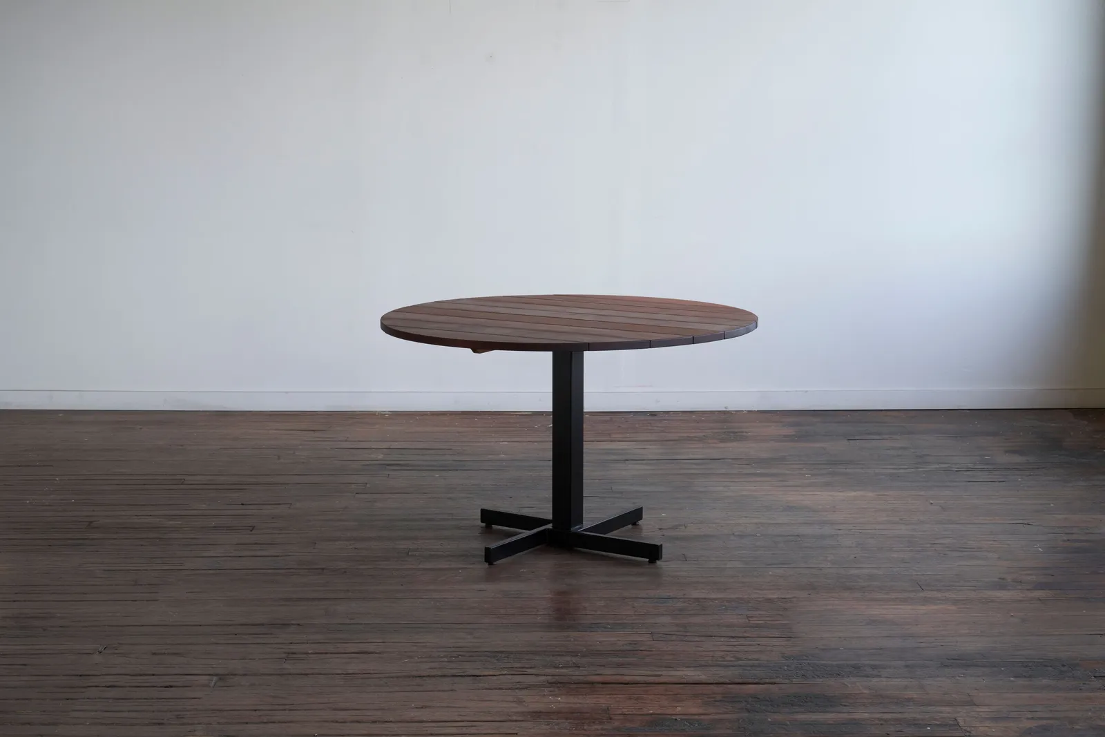 custom outdoor cafe table in ipe wood with steel base by Icon Modern