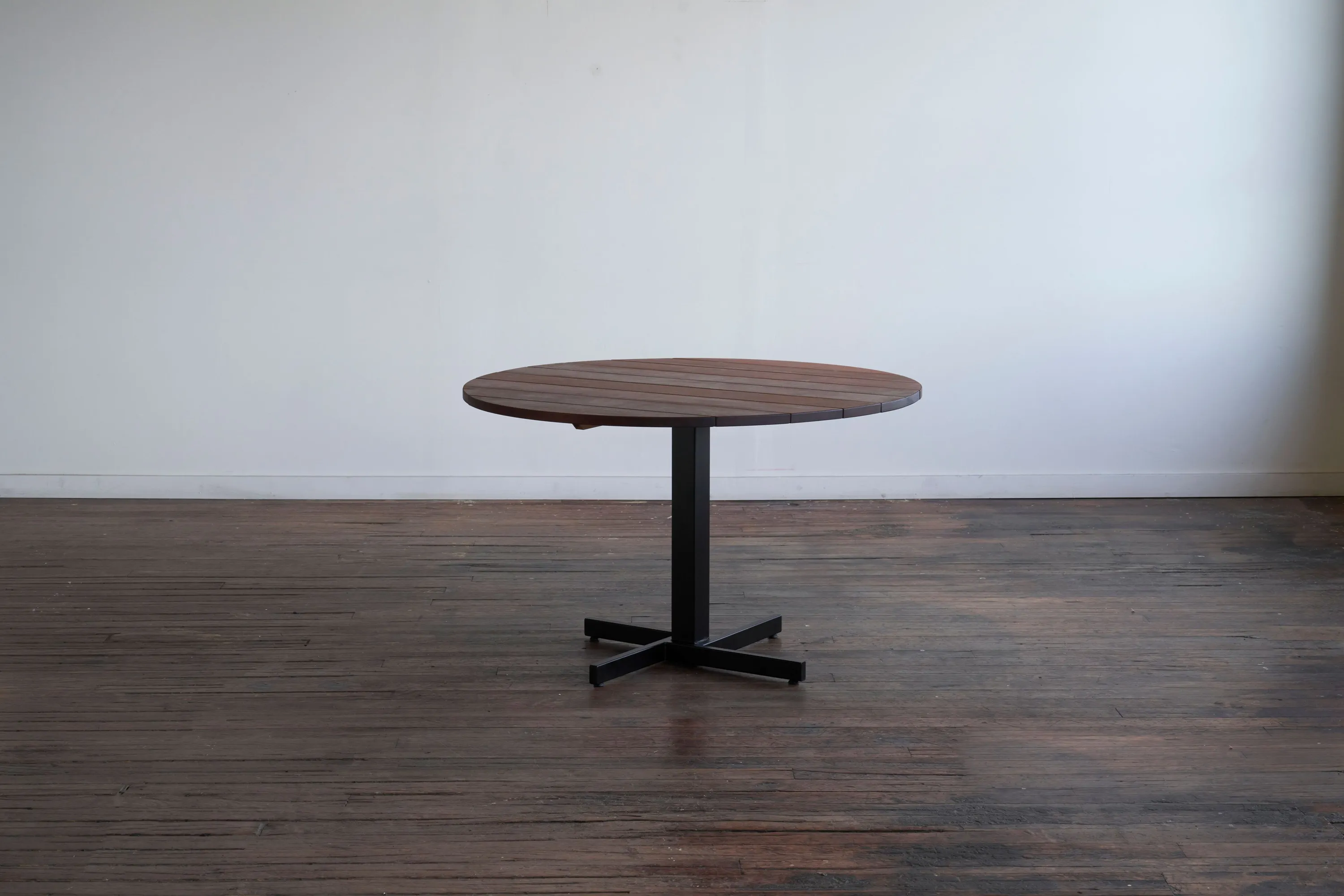 custom outdoor cafe table in ipe wood with steel base by Icon Modern