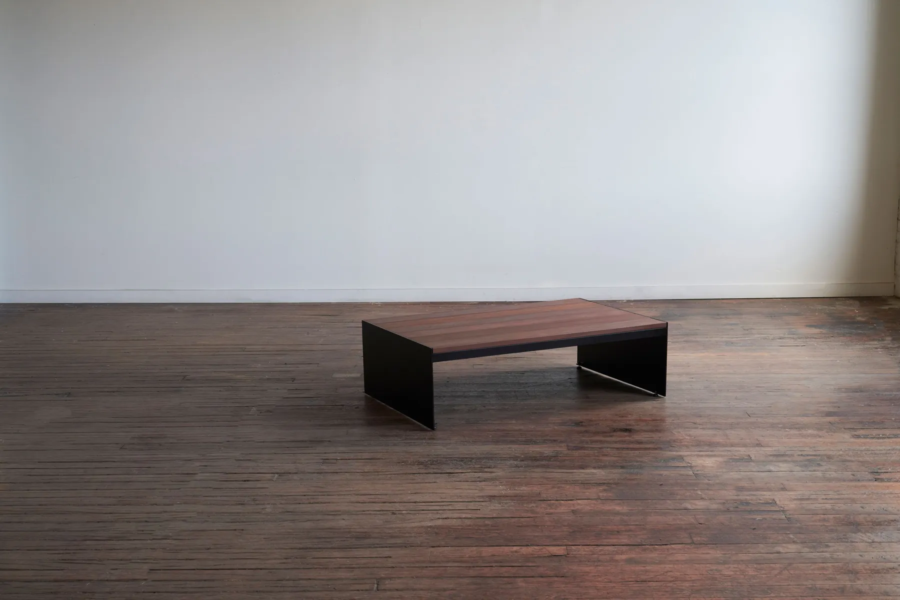 custom outdoor coffee table in ipe wood slats and steel panel base by Icon Modern