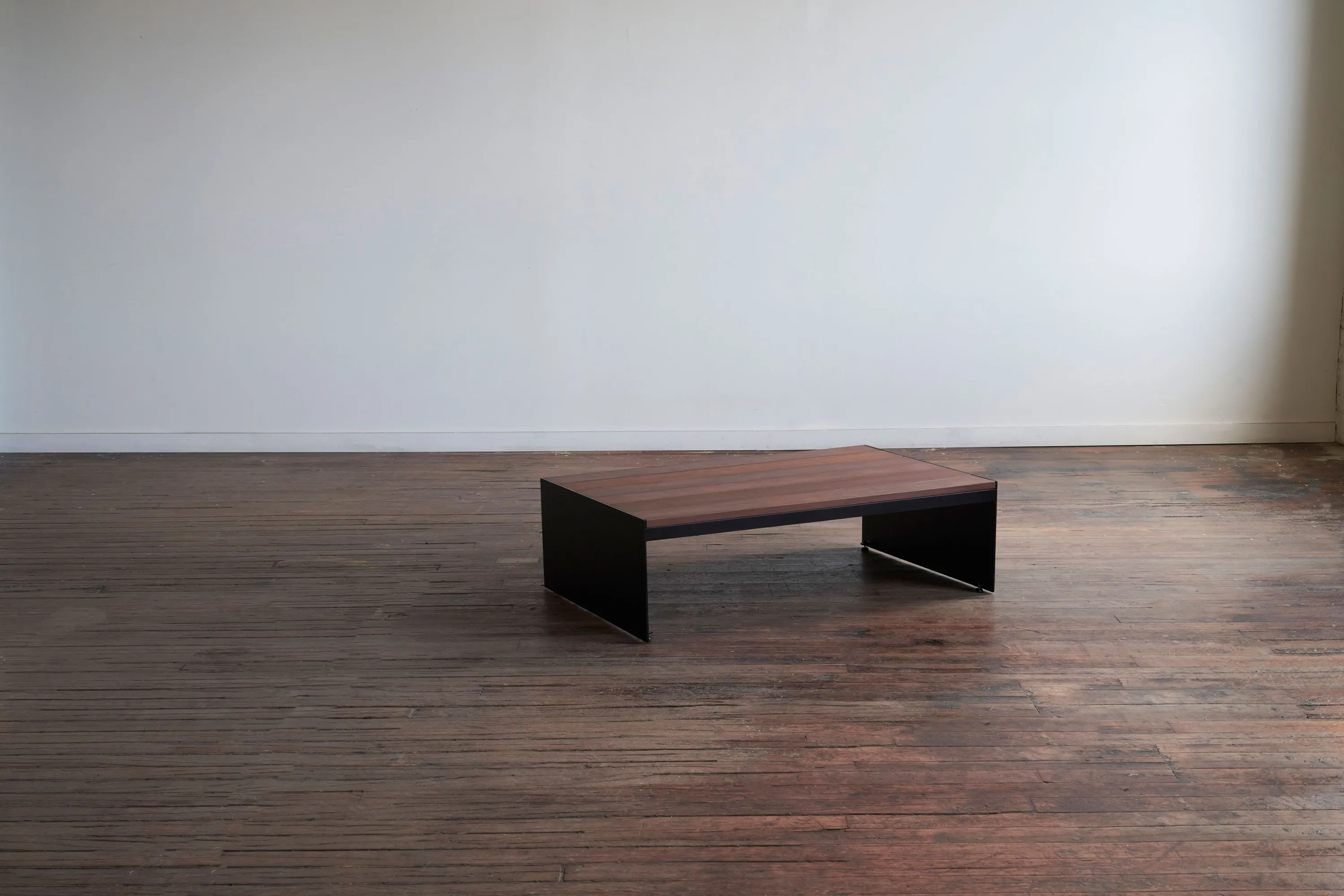 custom outdoor coffee table in ipe wood slats and steel panel base by Icon Modern