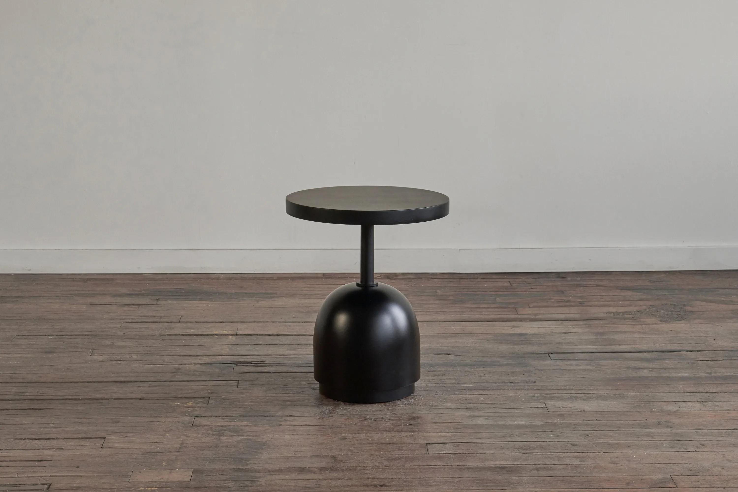 custom side table in ebonized maple wood with turned base + steel support by Icon Modern