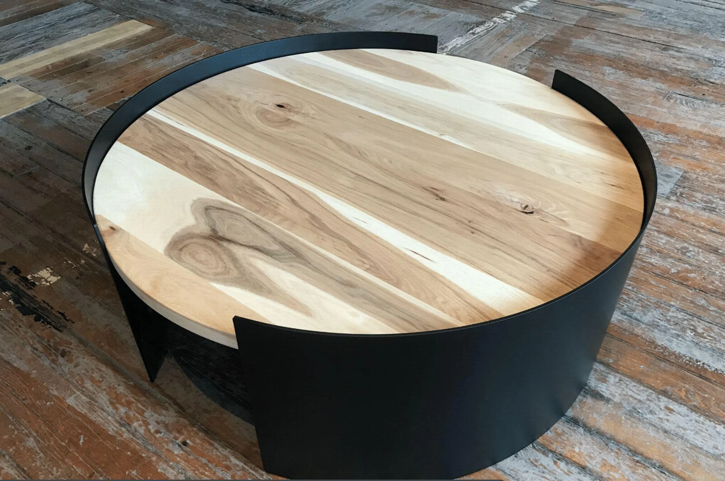 custom coffee table in urban hickory with rolled steel base by Icon Modern