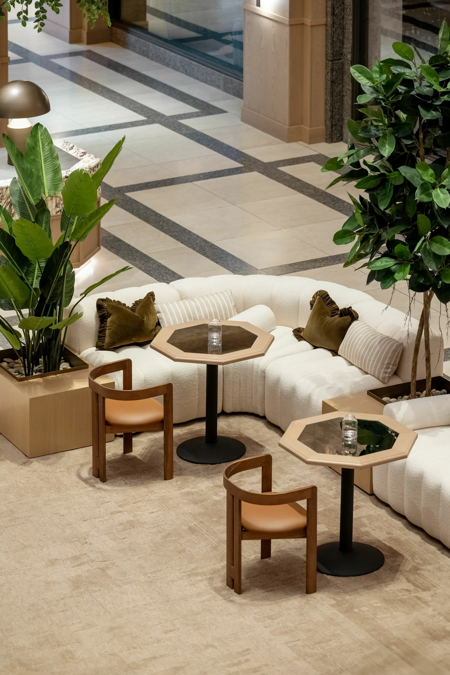 custom cafe tables featuring an antique mirror framed by oak veneer by Icon Modern