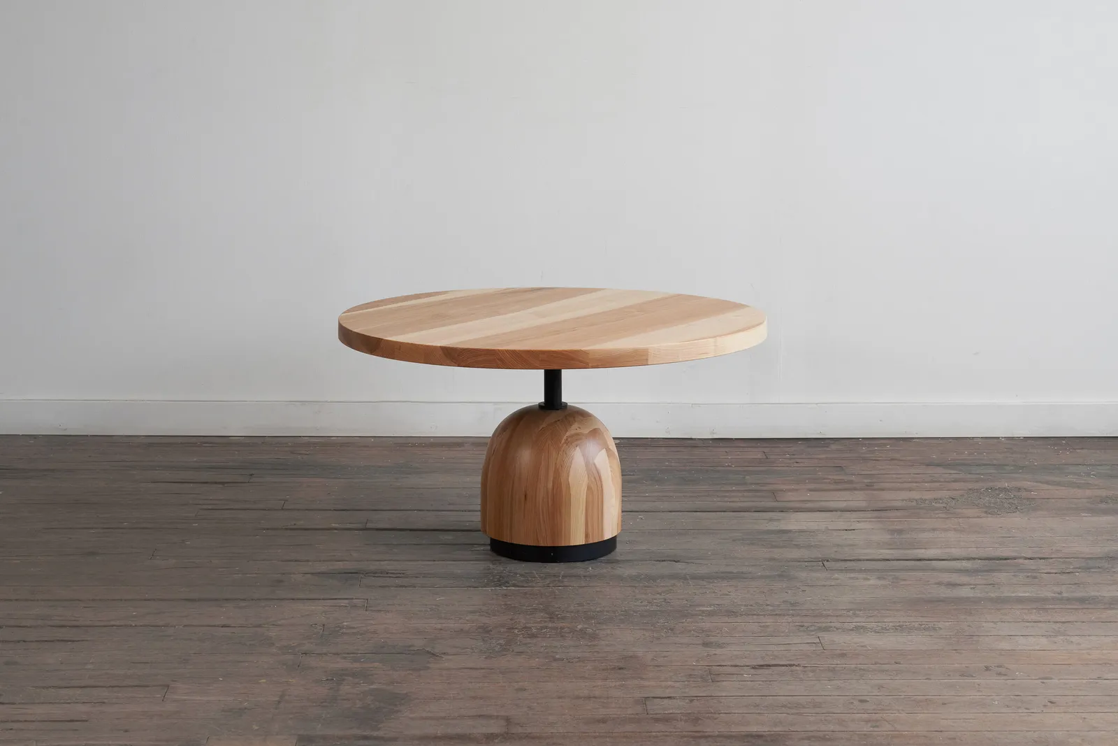 custom coffee table in urban hickory wood and turned base by Icon Modern