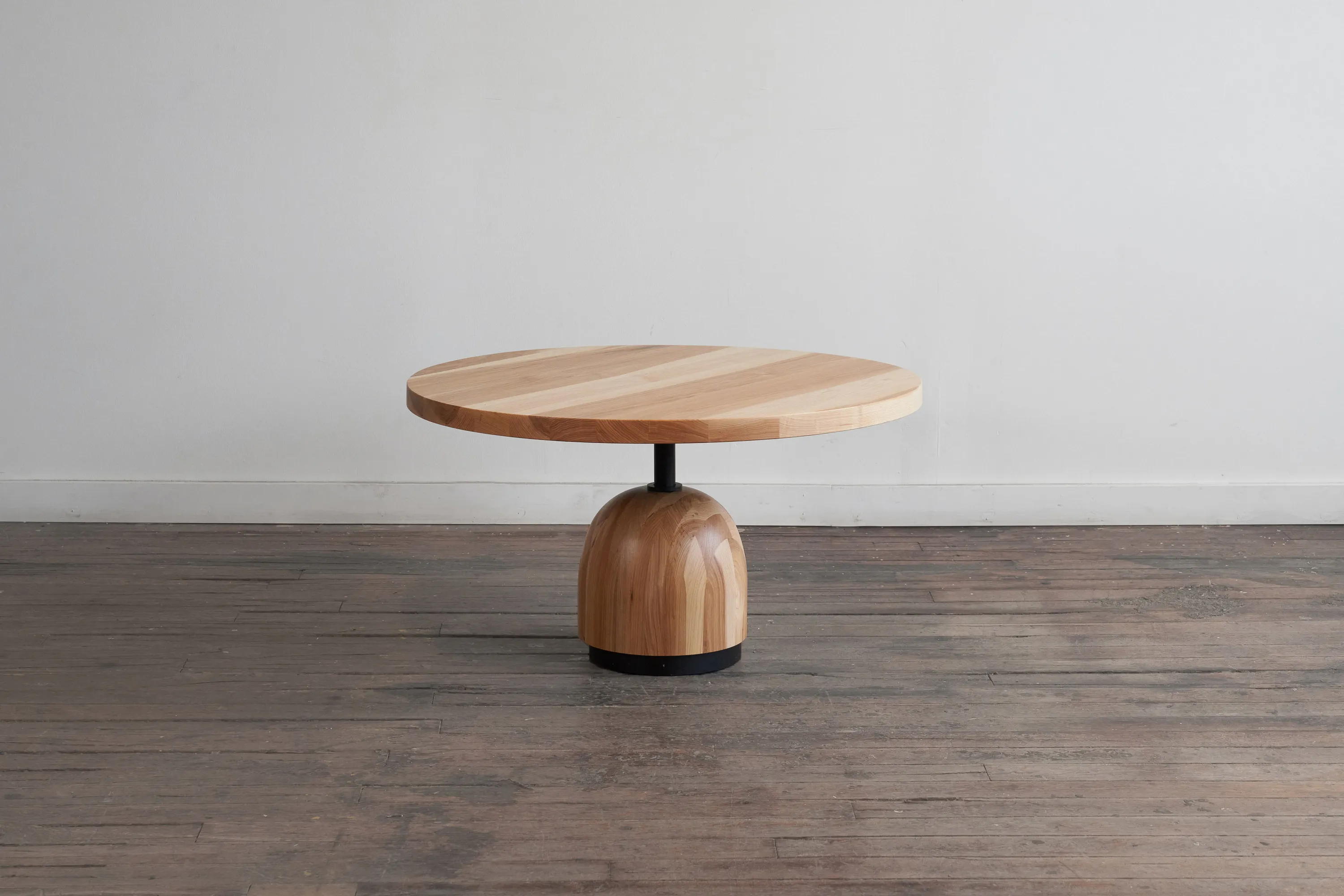 custom coffee table in urban hickory wood and turned base by Icon Modern