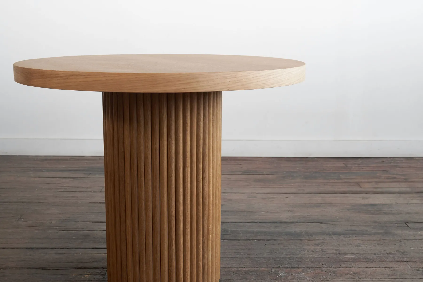custom cafe table in urban oak with tambour base by Icon Modern