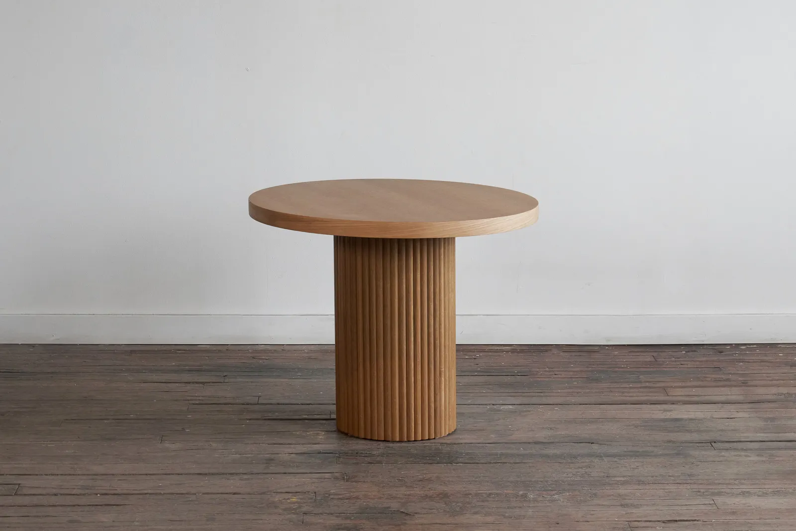 custom cafe table in urban oak with a tambour base by Icon Modern