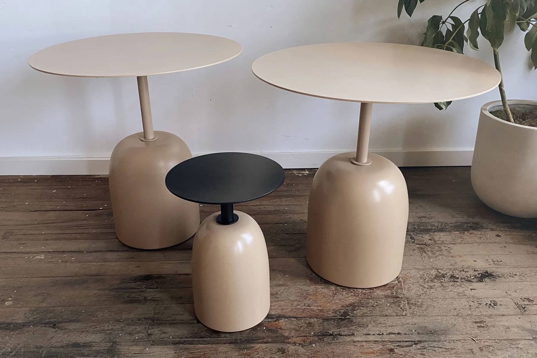custom side tables with steel tops and turned bases by Icon Modern