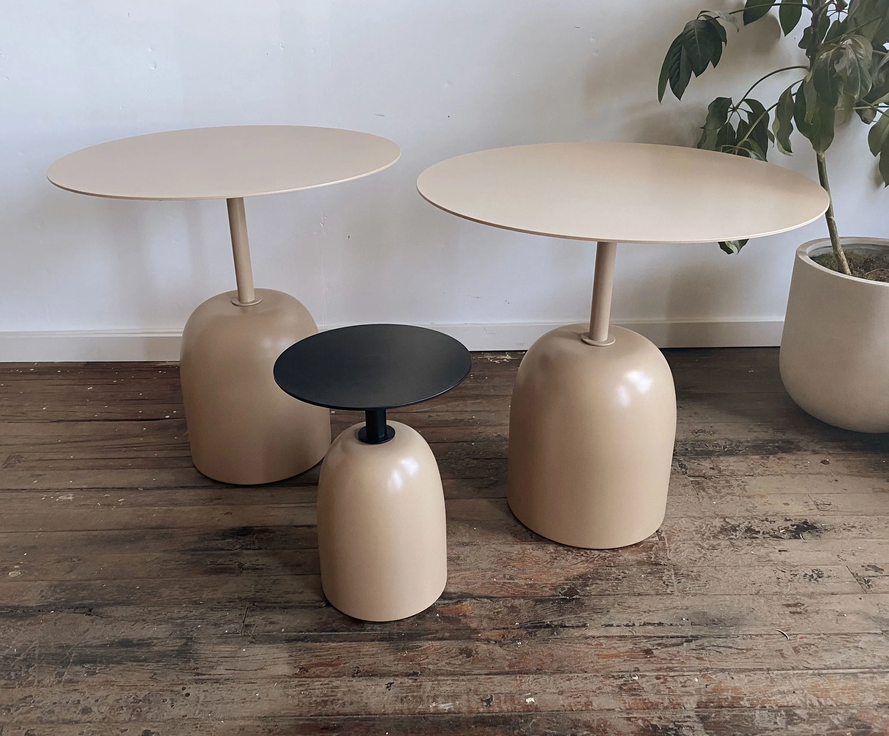 custom side tables with steel tops and turned bases by Icon Modern