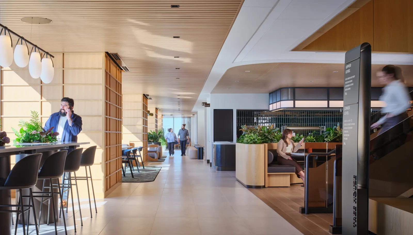 custom stone table with integrated steel drum planter bases by Icon Modern (left in photo)