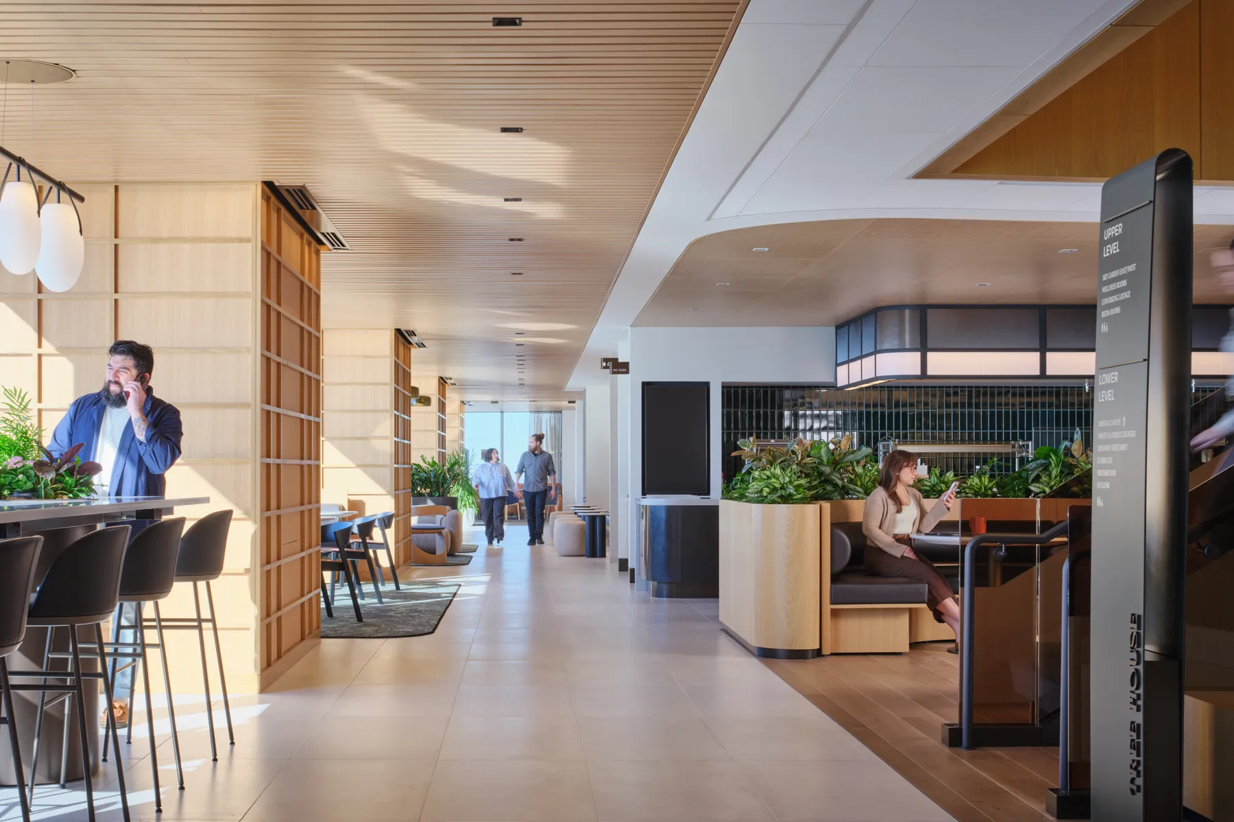 custom stone table with integrated steel drum planter bases by Icon Modern (left in photo)
