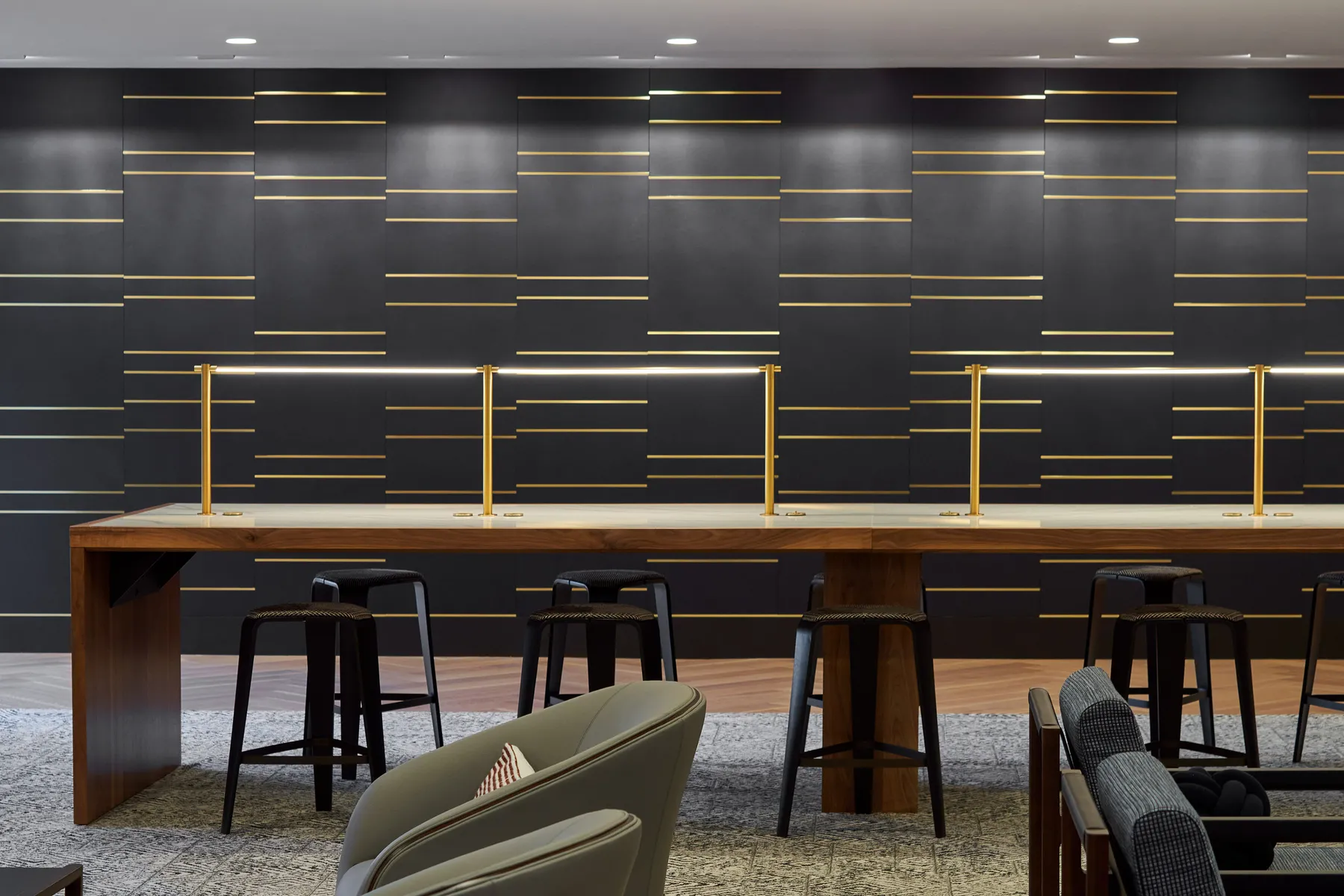 custom library table in walnut hardwood and stone by Icon Modern