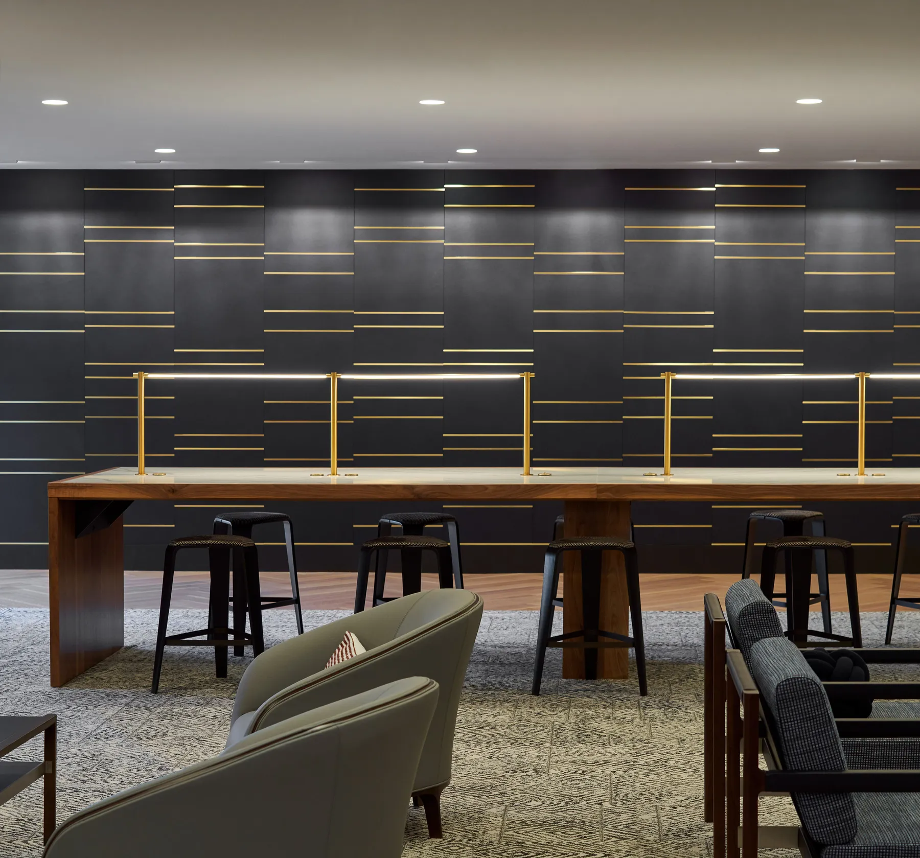 custom library table in walnut hardwood and stone by Icon Modern