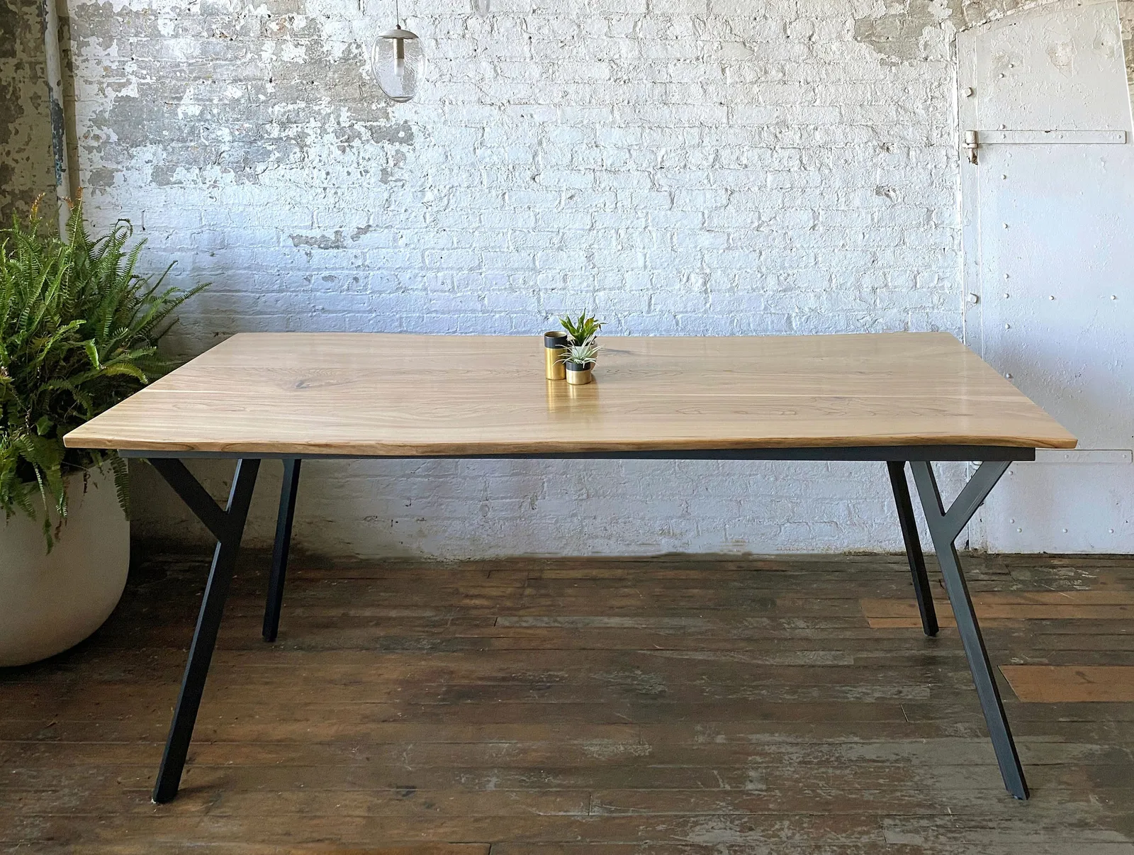 custom community table in urban oak by Icon Modern