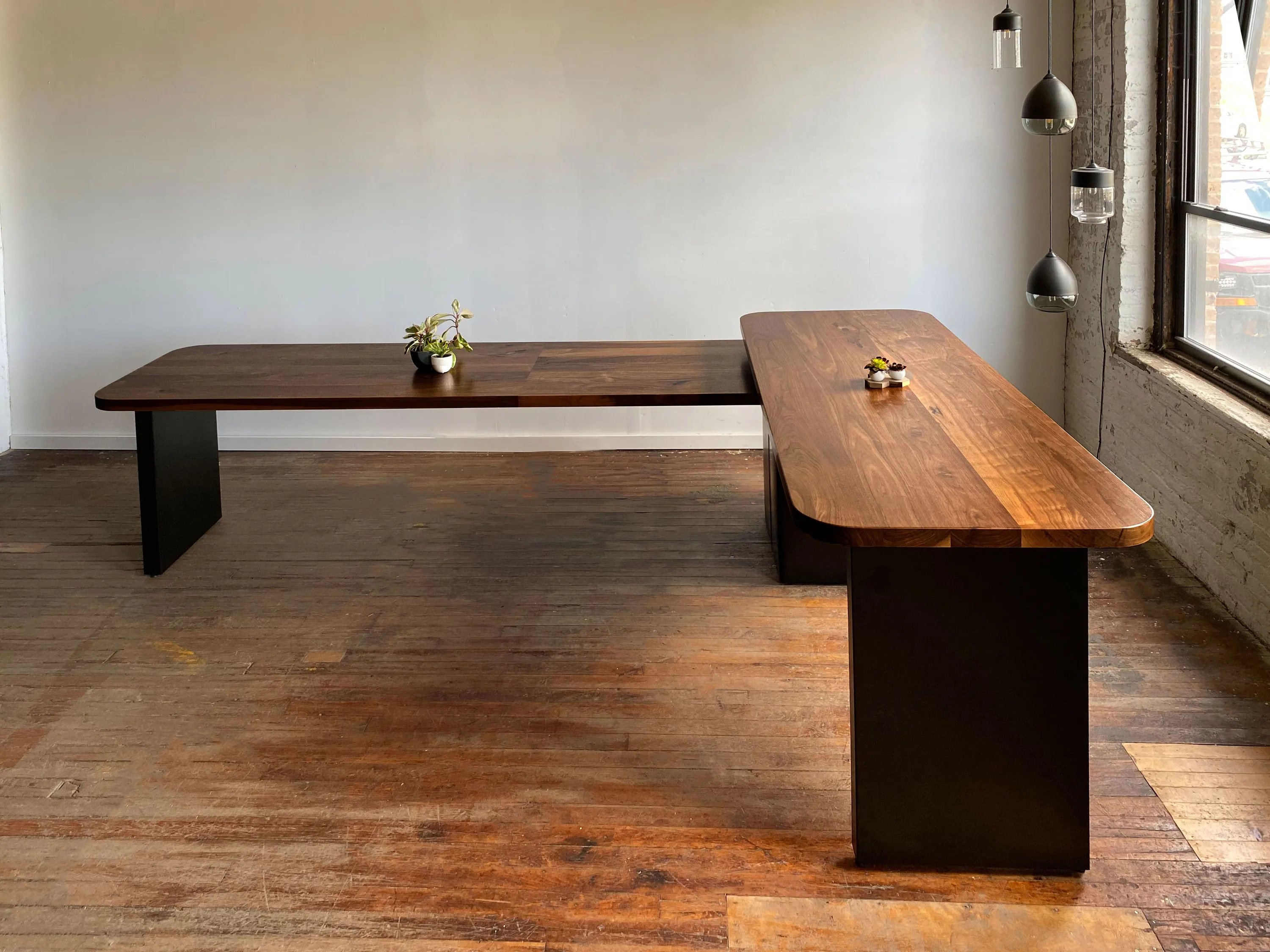 custom community table in urban walnut by Icon Modern