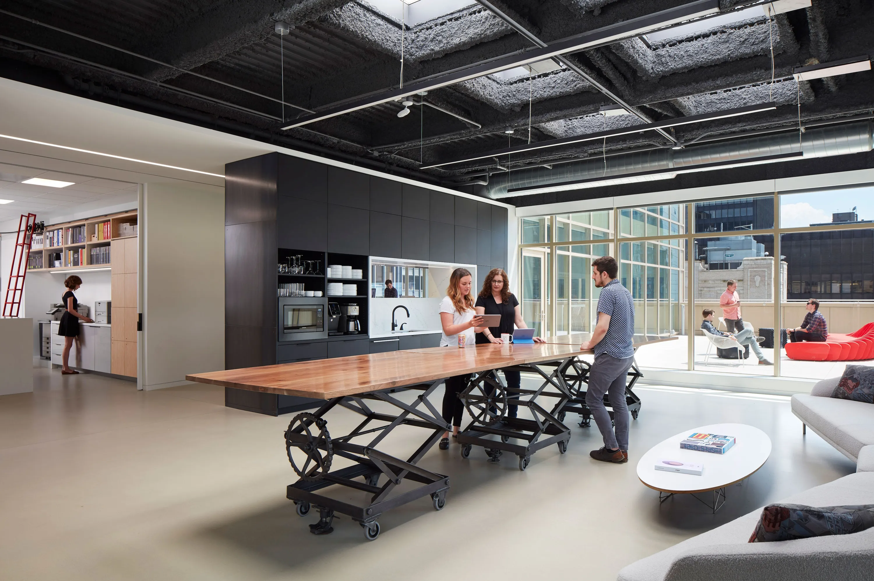 custom community table with reclaimed scissor life by Icon Modern