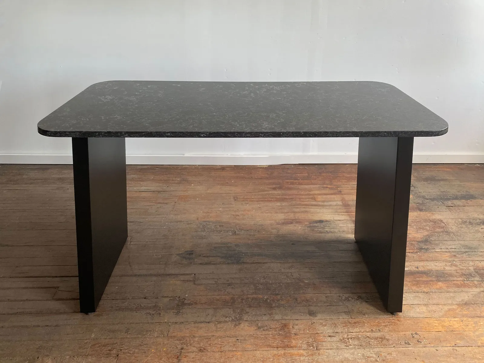 custom community table in stone by Icon Modern