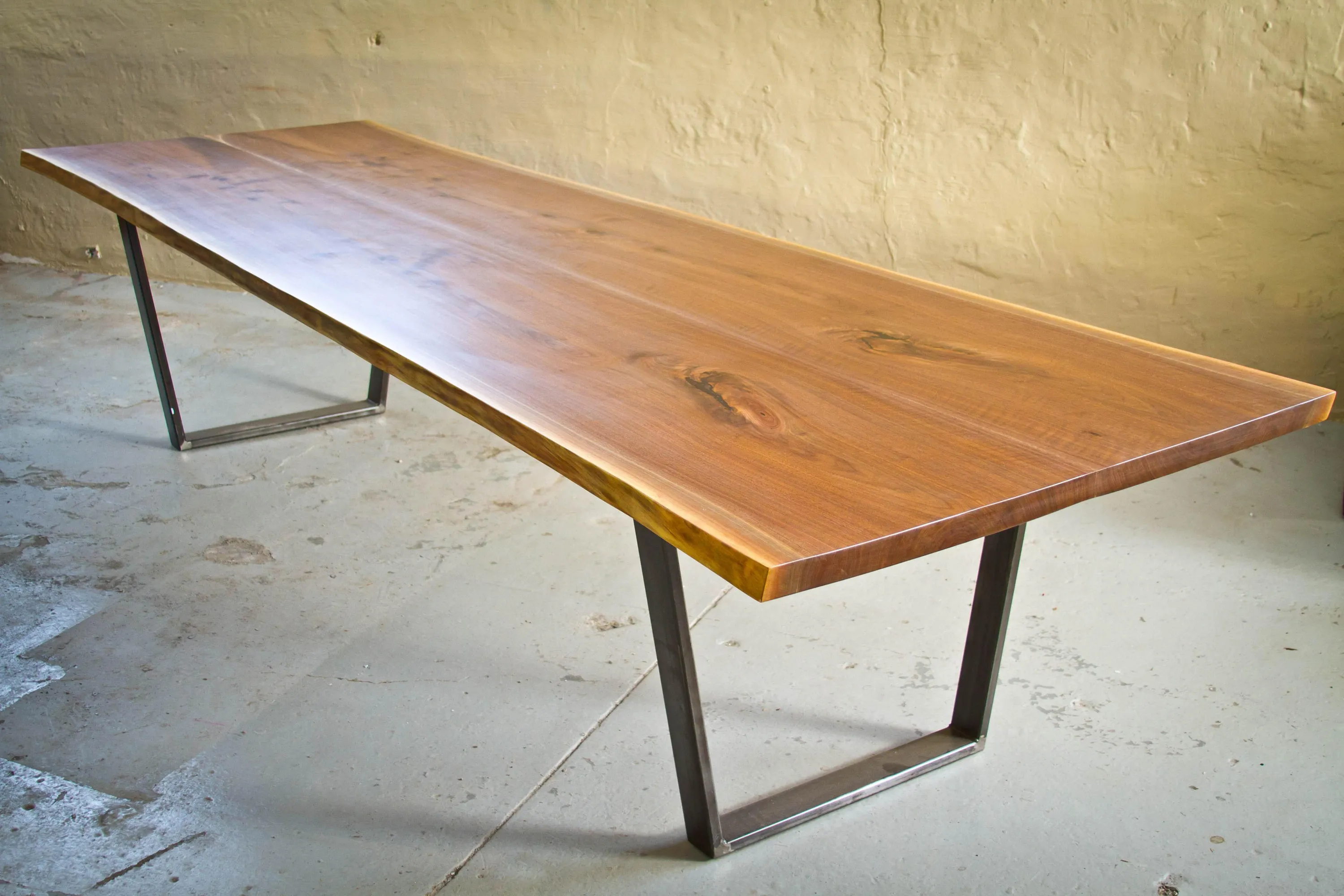 Custom urban wood live edge walnut conference table trapezoid steel base by icon modern