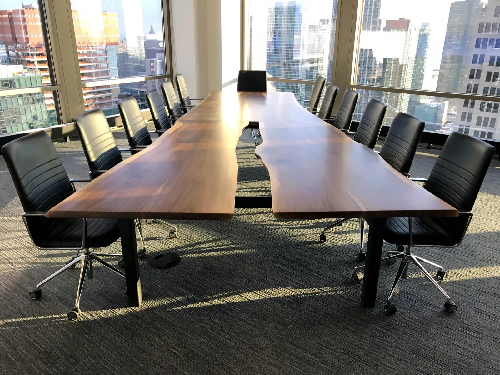 Custom urban live edge walnut conference table slab opening by icon modern