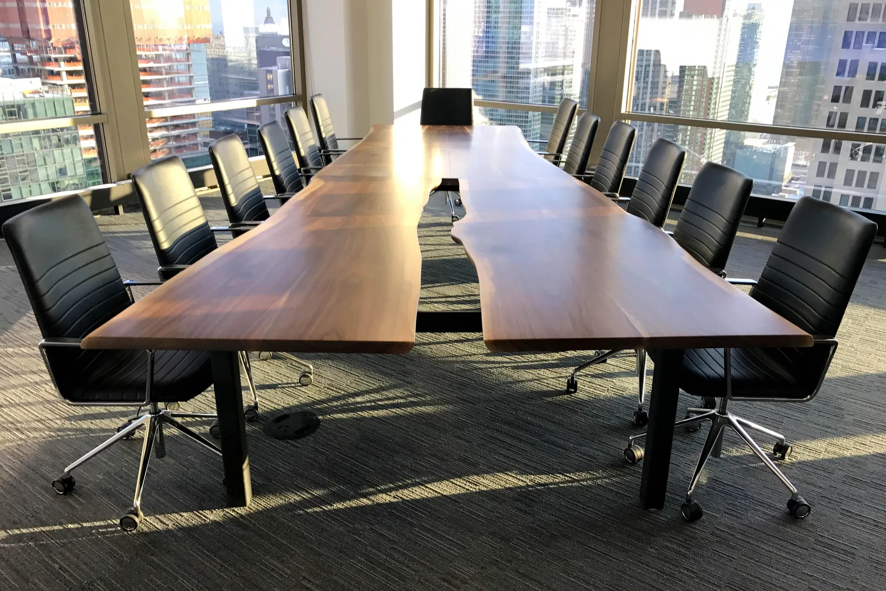 Custom urban live edge walnut conference table slab opening by icon modern