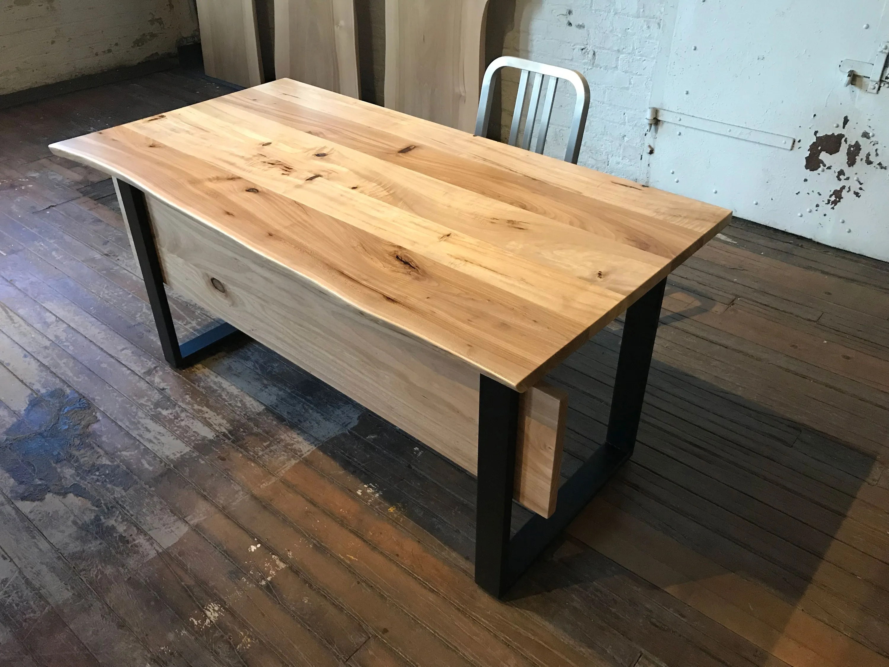 custom desk in elm wood with strap style base by Icon Modern