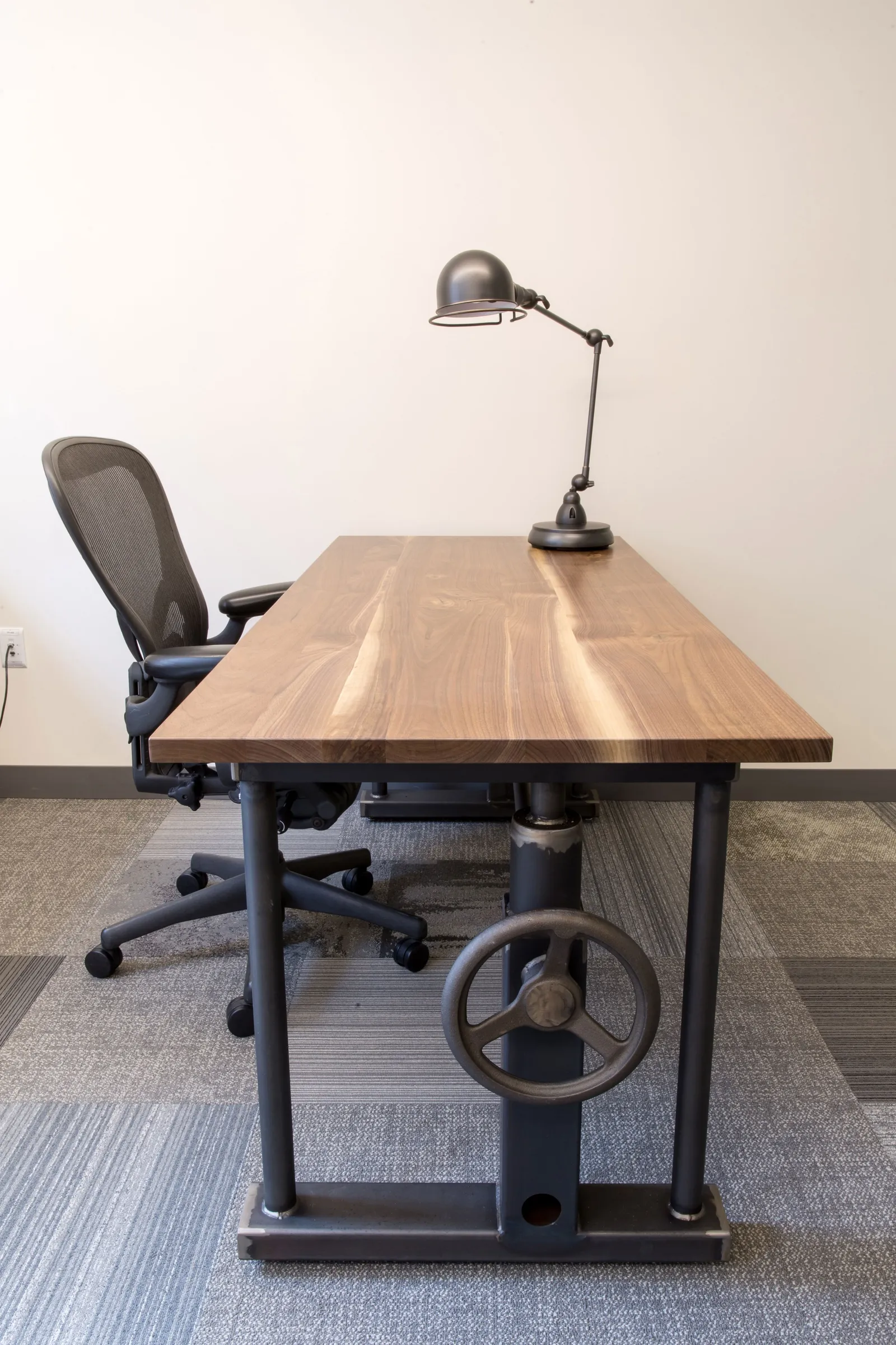 Custom desk in walnut with custom reclaimed base by Icon Modern
