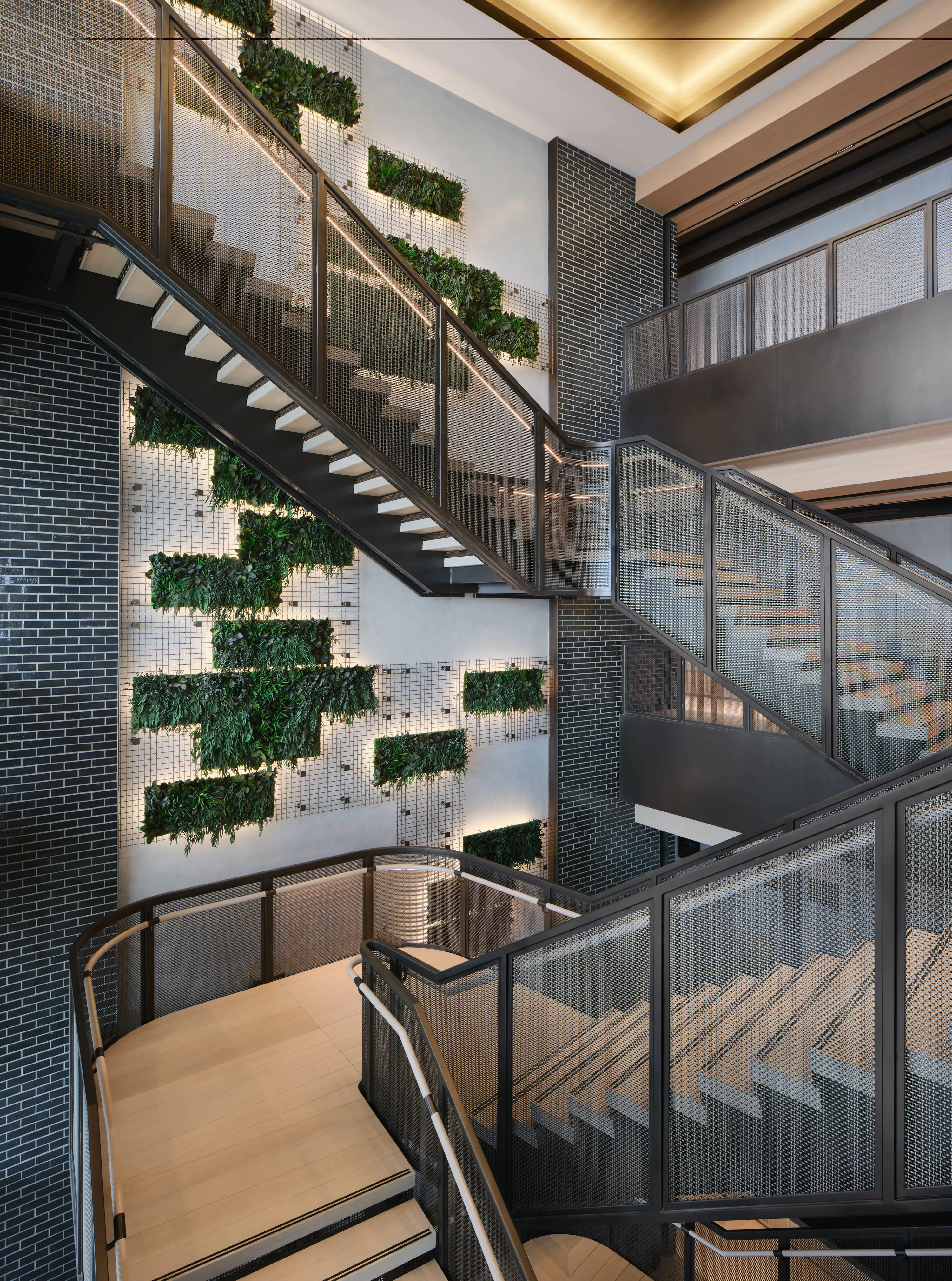 custom green wall with metal mesh panels by Icon Modern