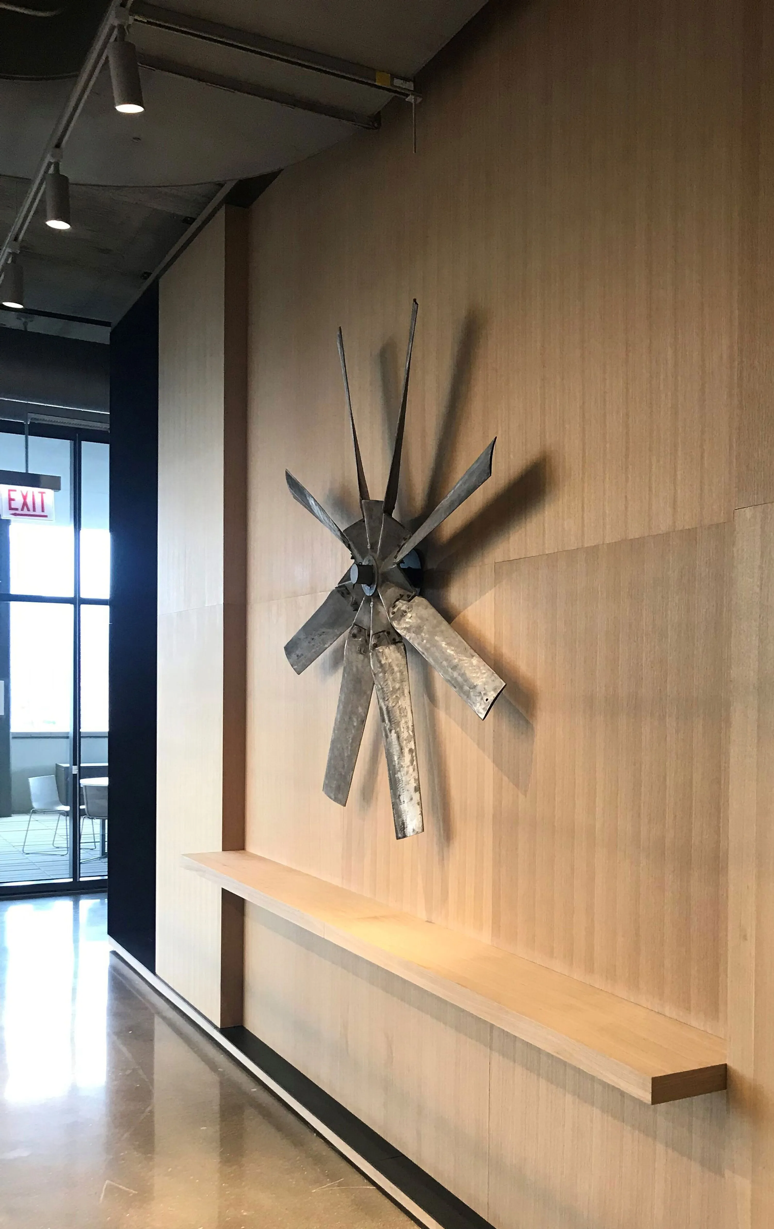custom feature wall using reclaimed plane propeller parts