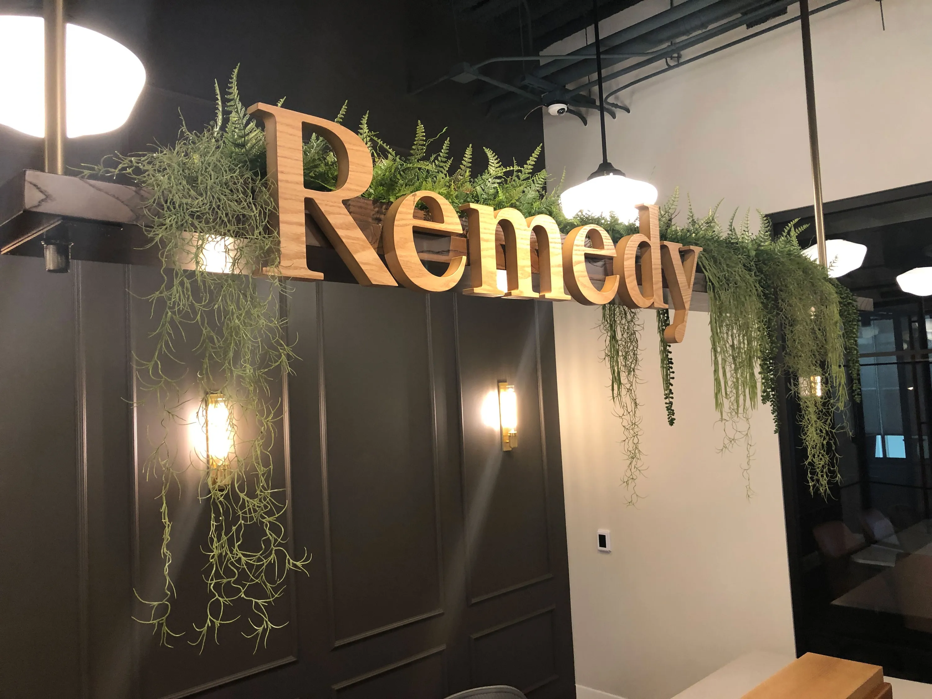 custom hanging planter made from urban wood and steel with faux plants