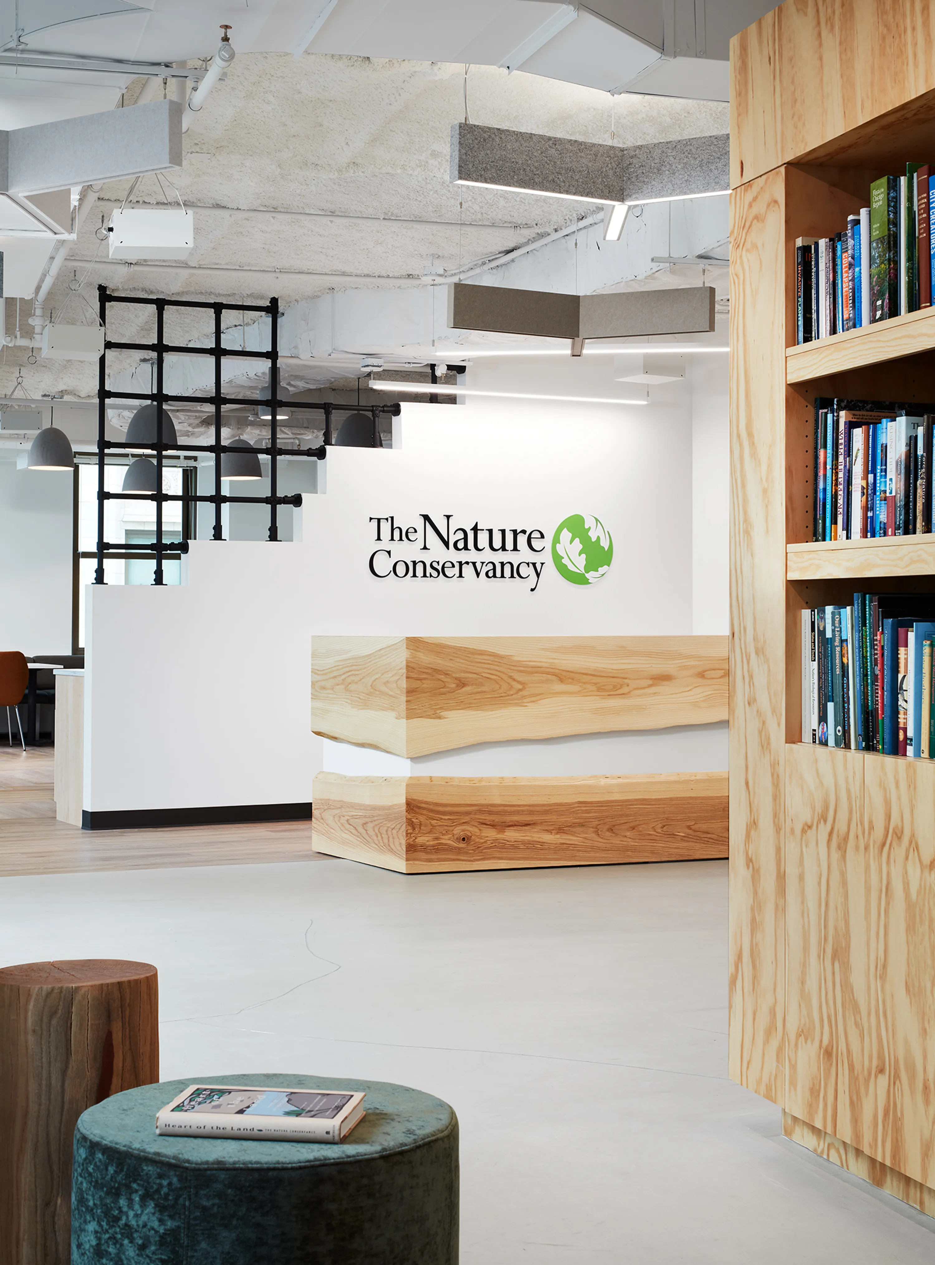 custom reception desk featuring laminate and urban ash live edge slabs by Icon Modern