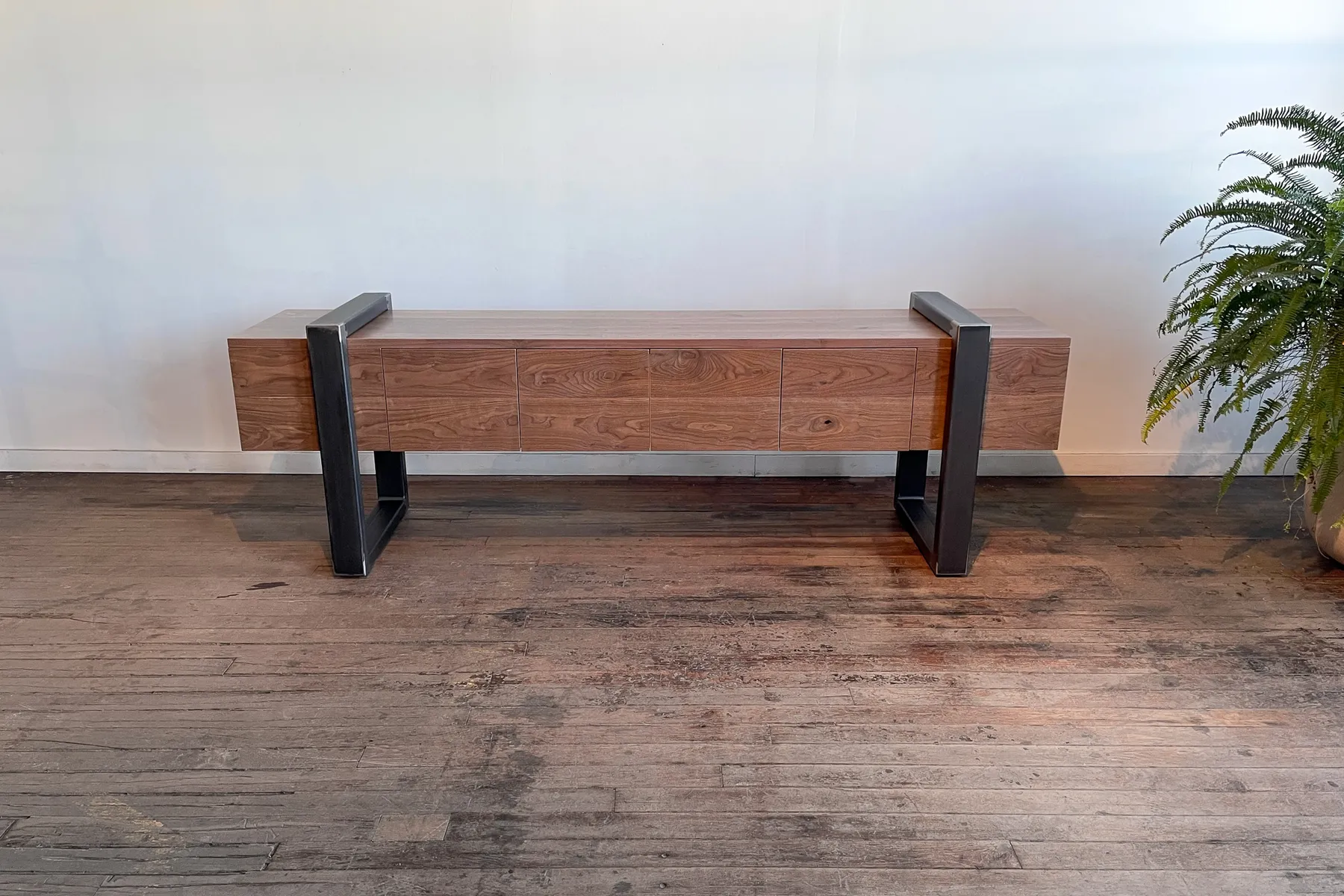 custom credenza in urban walnut with strap-style base