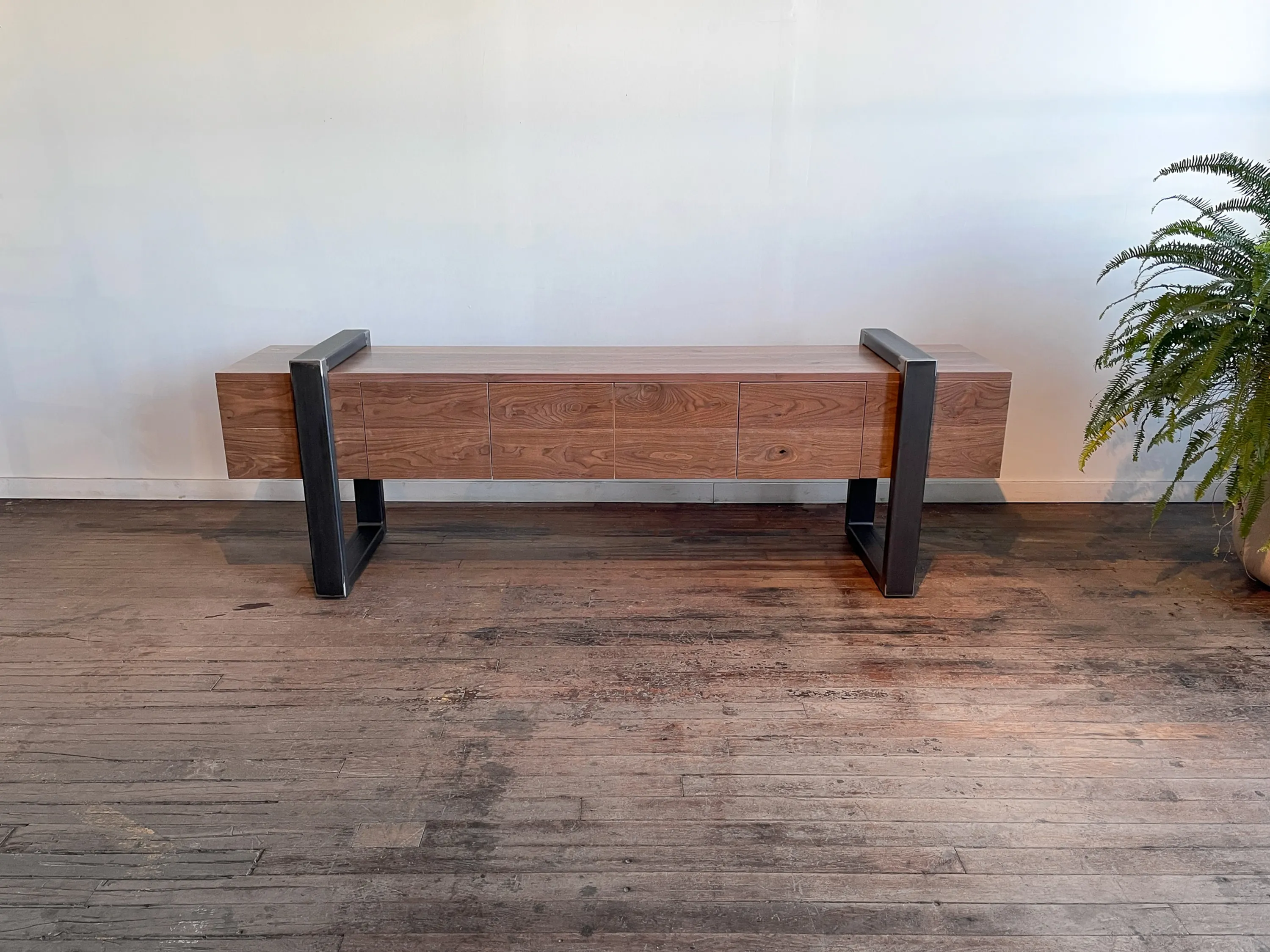 custom credenza in urban walnut with strap-style base