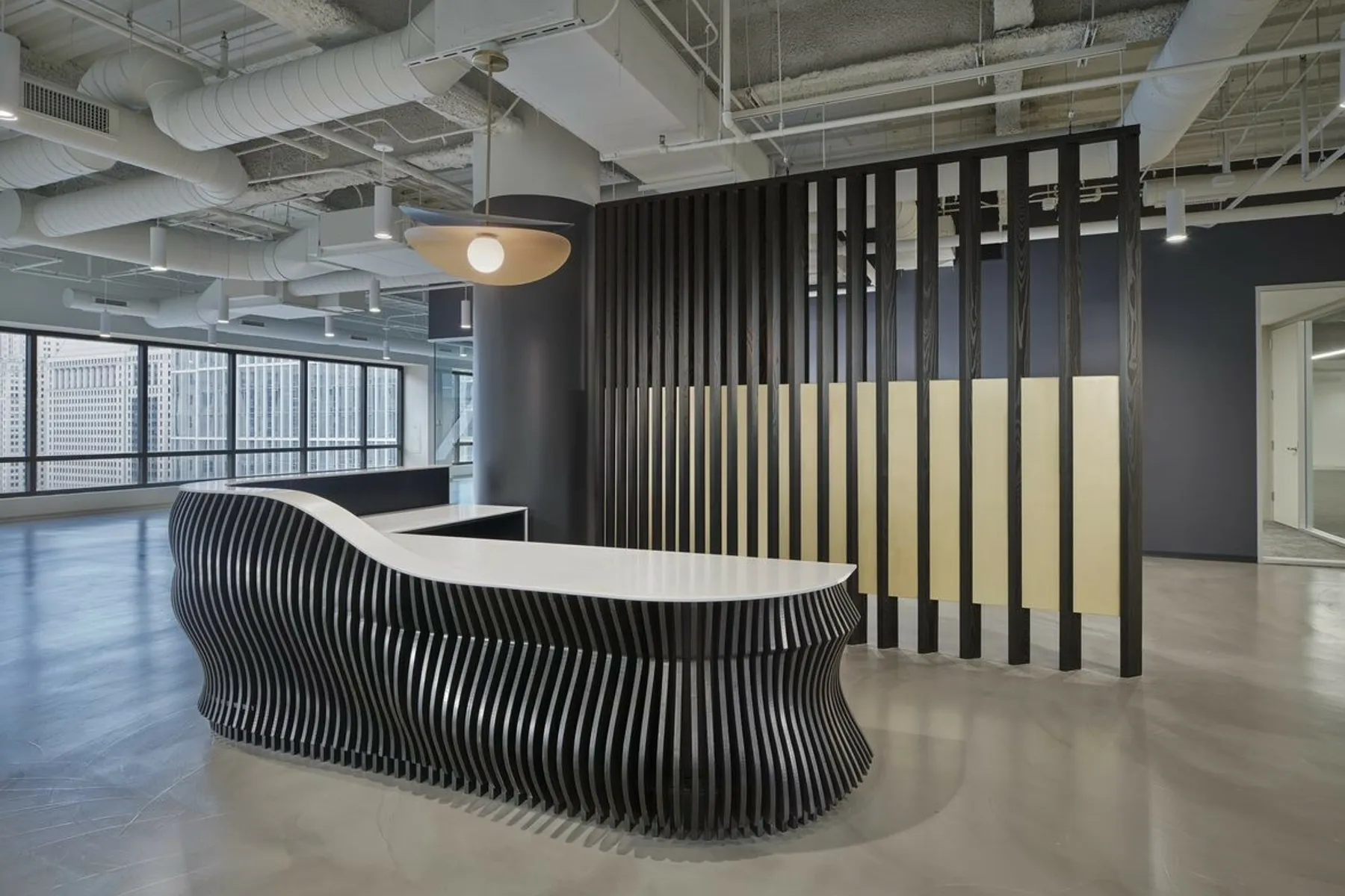 custom space divider featuring wood slats and metal infill panels by Icon Modern