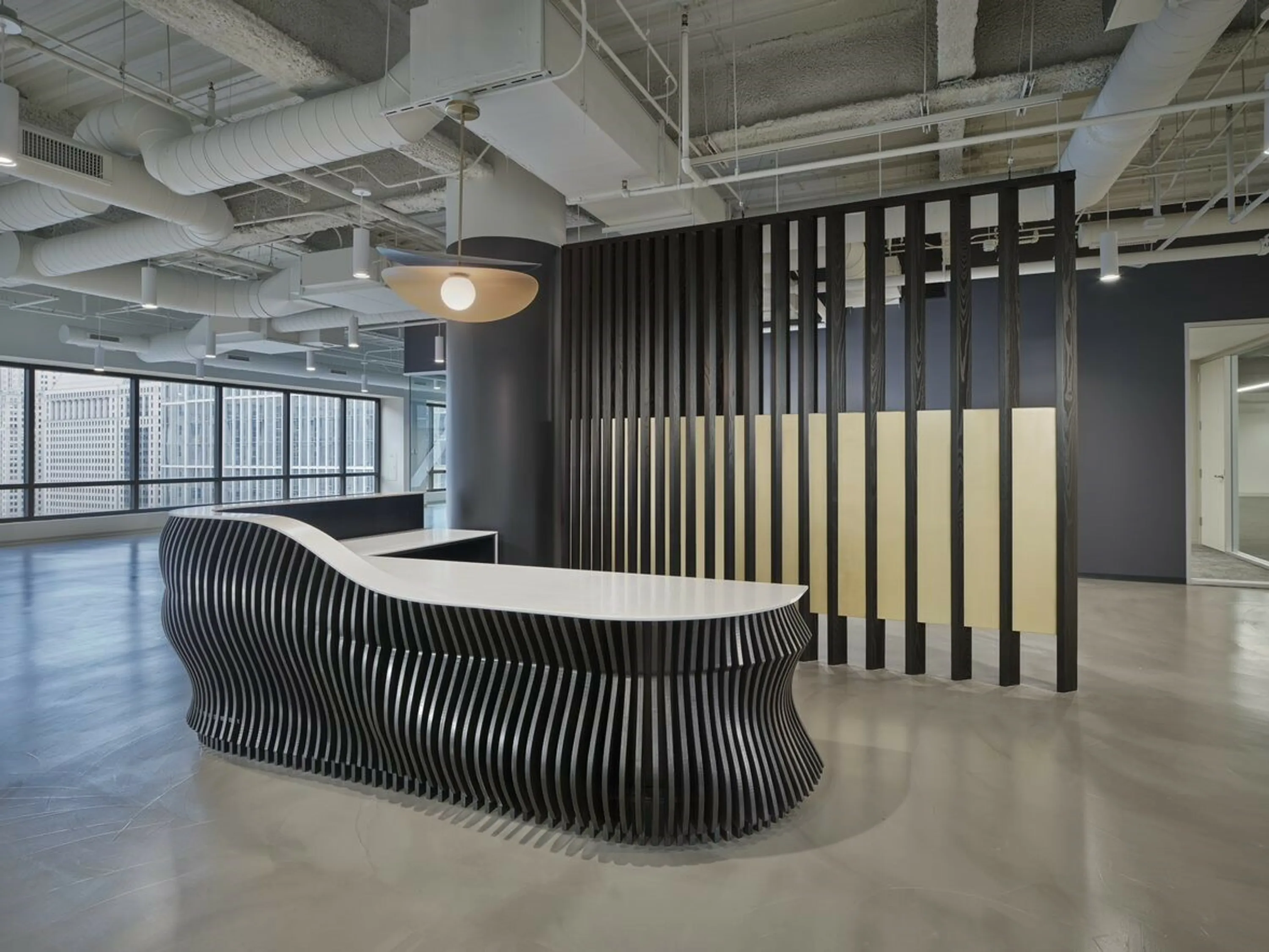 custom space divider featuring wood slats and metal infill panels by Icon Modern