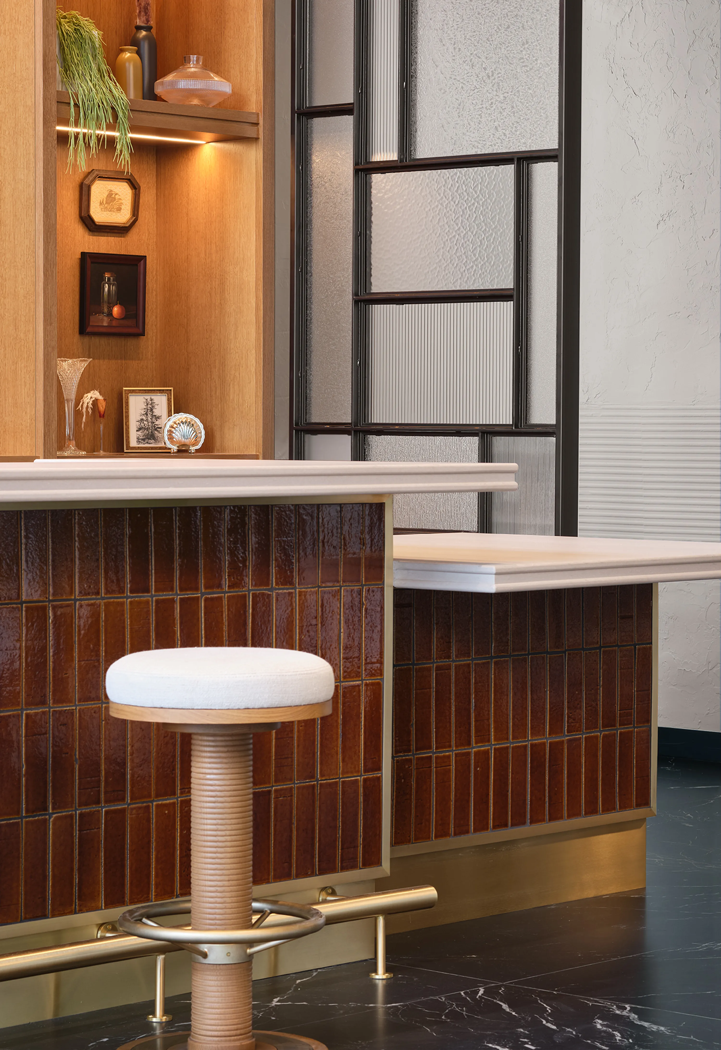 custom space divider with metal frame and glass infills by Icon Modern