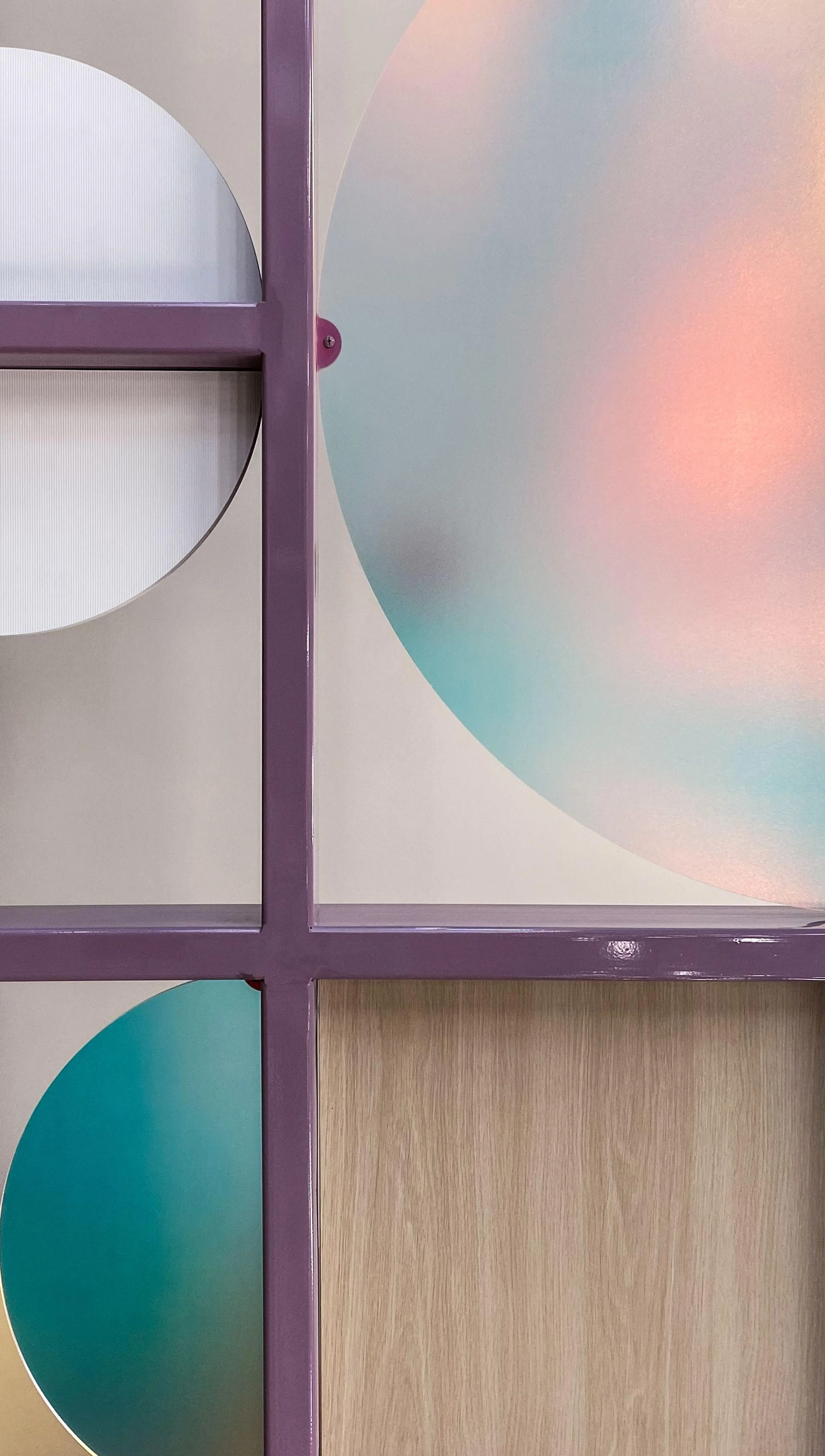 Custom space divider featuring dichroic panels and purple powdercoated steel by Icon Modern
