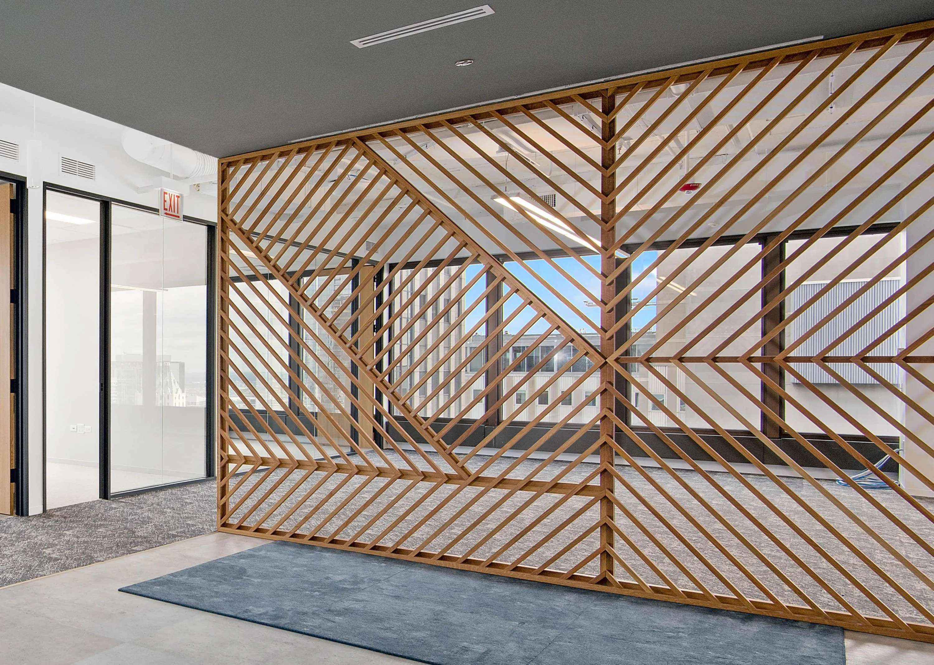 custom space divider in oak slats by Icon Modern