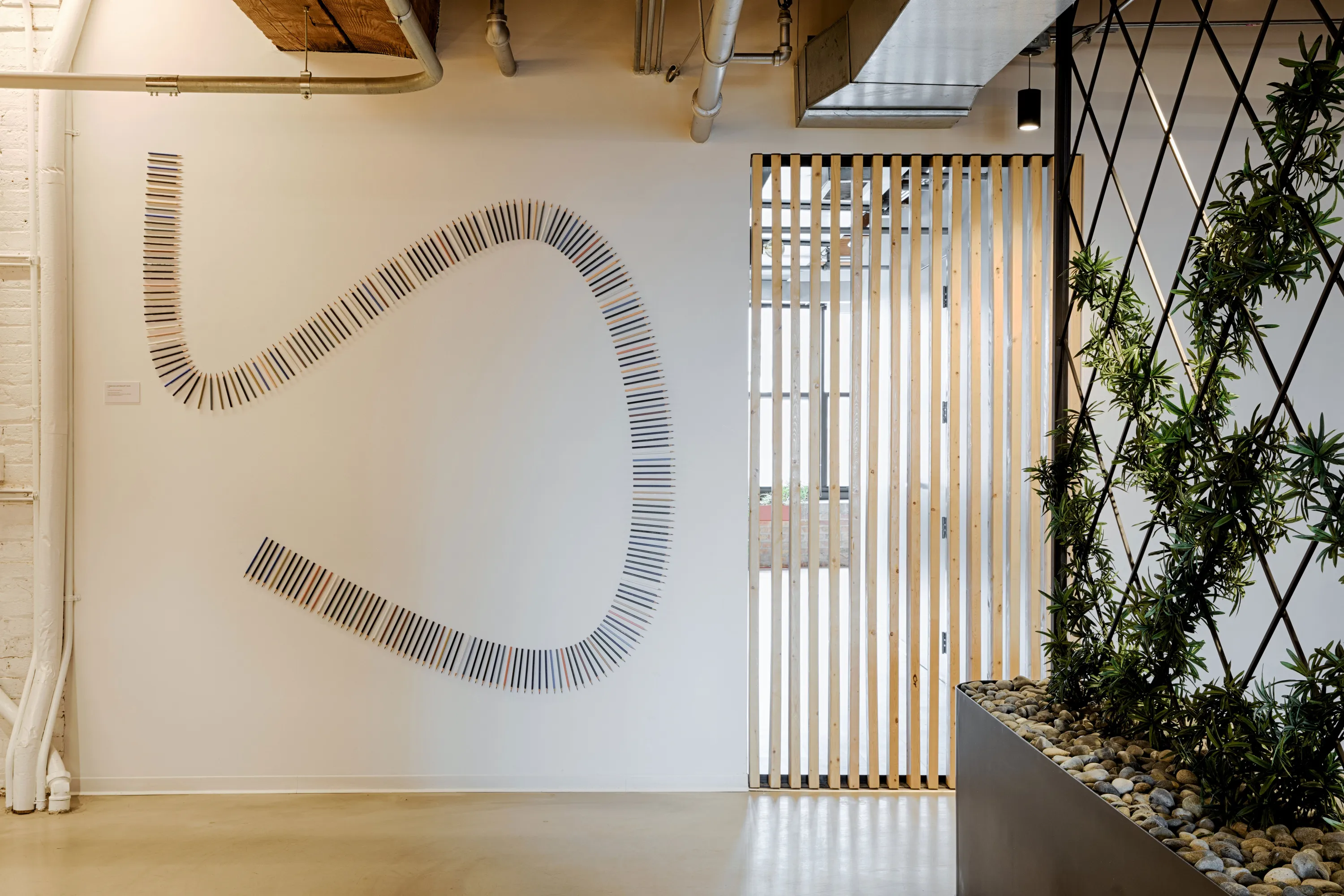 custom space divider in poplar slats by Icon Modern