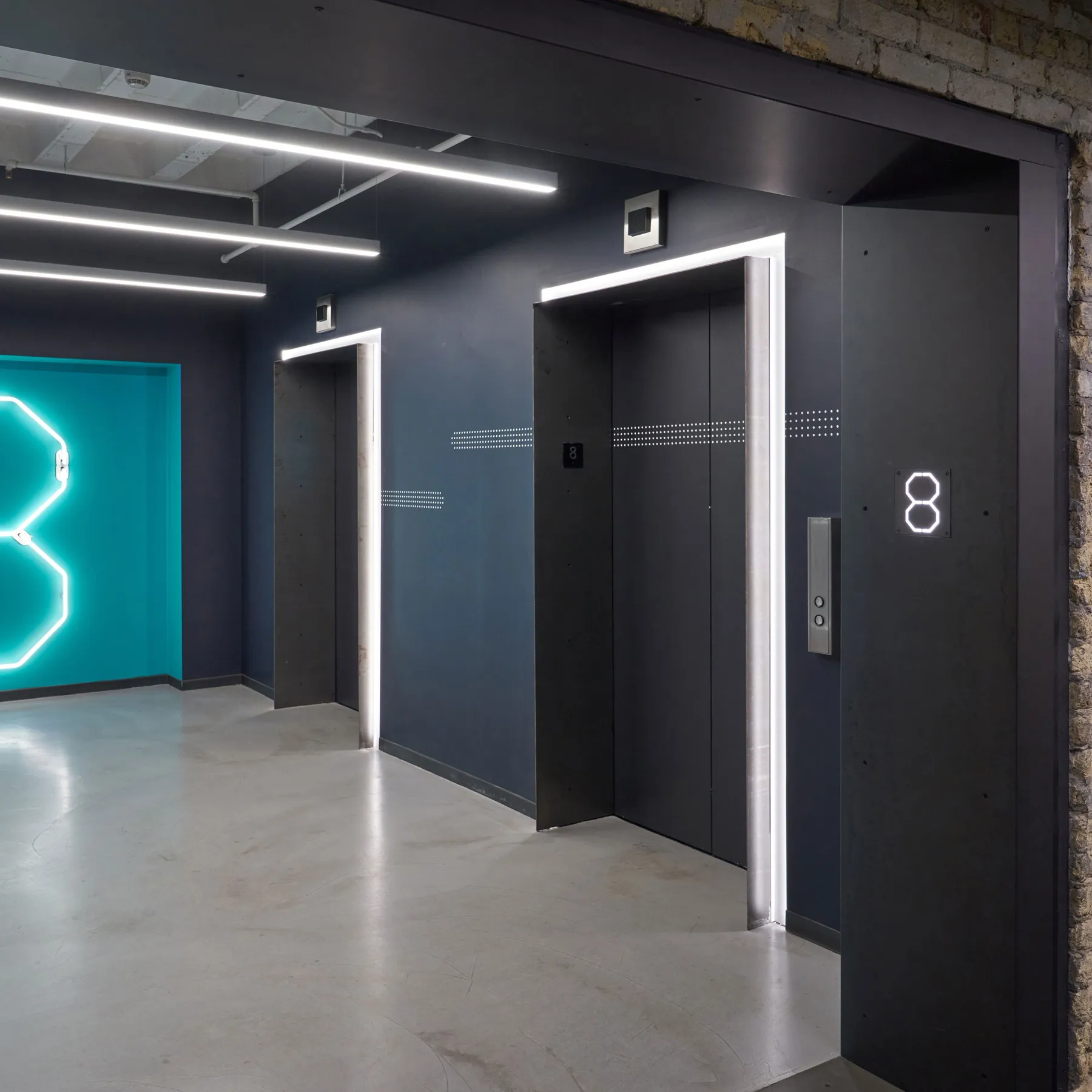 custom wall treatments in hot rolled steel for elevator banks by Icon Modern