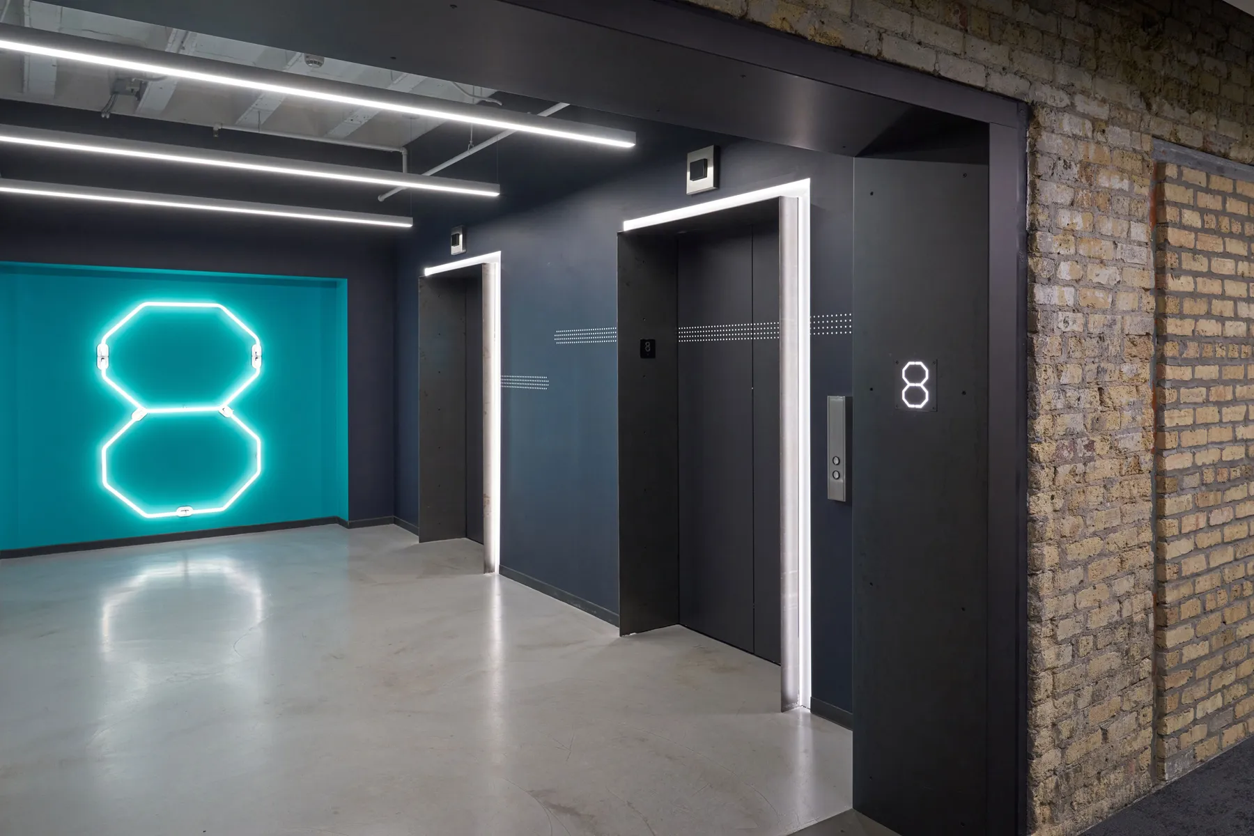 custom wall treatments in hot rolled steel for elevator banks by Icon Modern