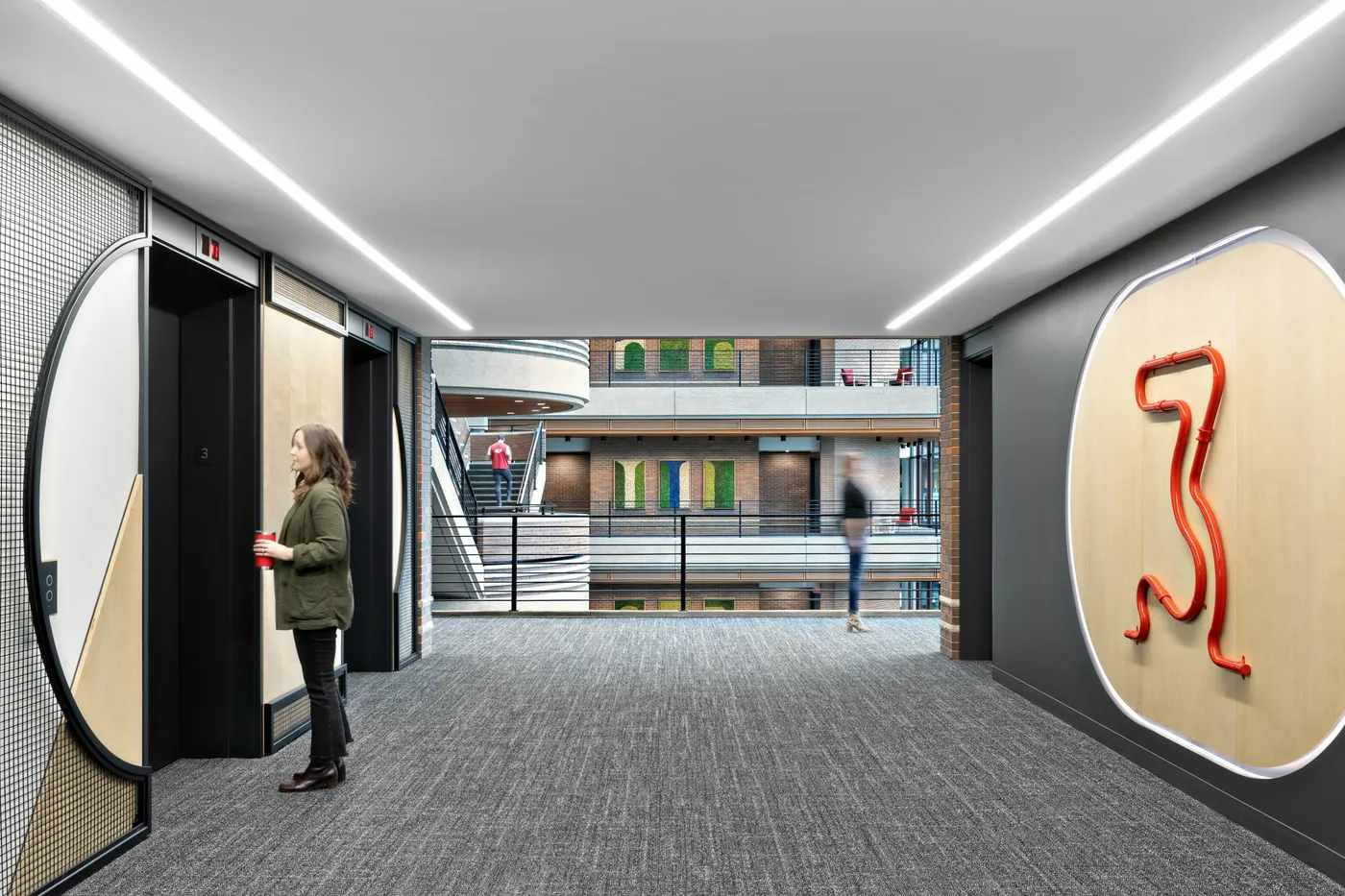 custom arched steel + wire mesh feature walls + bent steel pipe elevator signage by Icon Modern