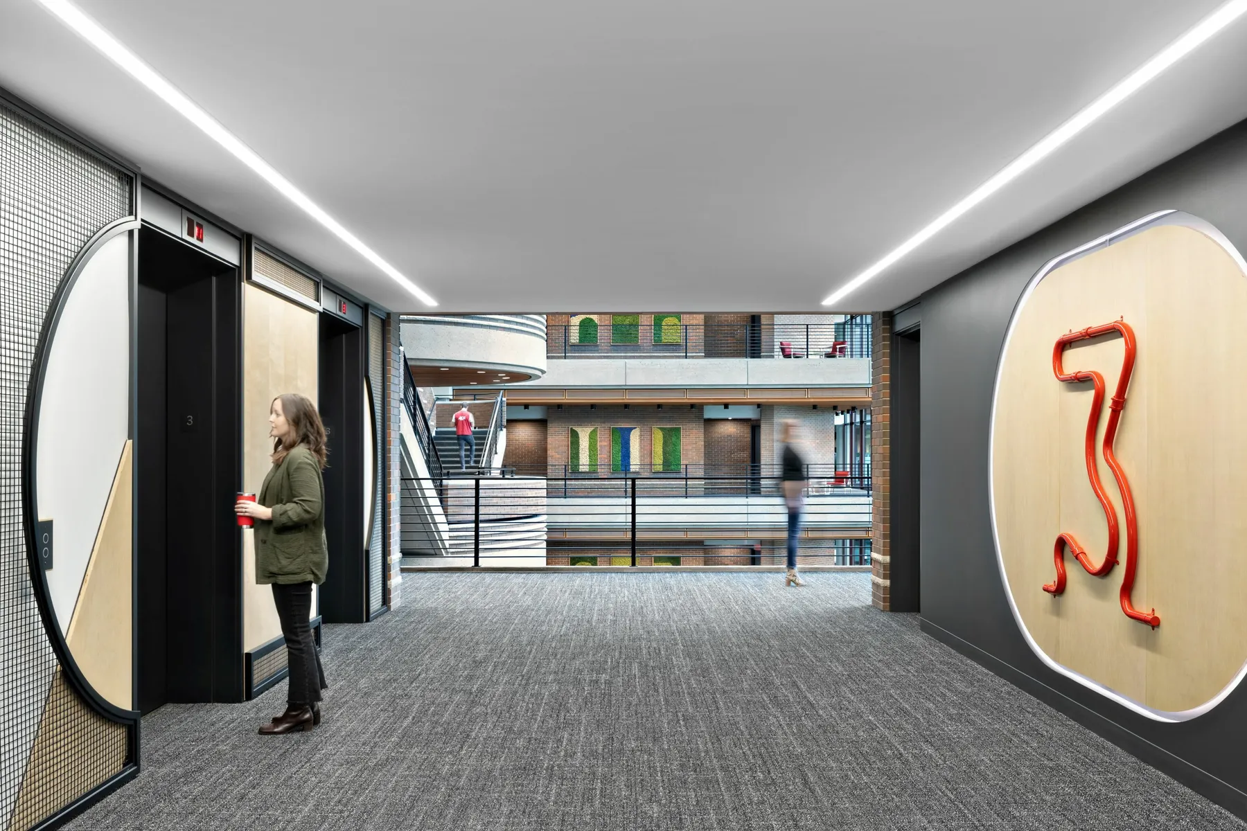 custom arched steel + wire mesh feature walls + bent steel pipe elevator signage by Icon Modern