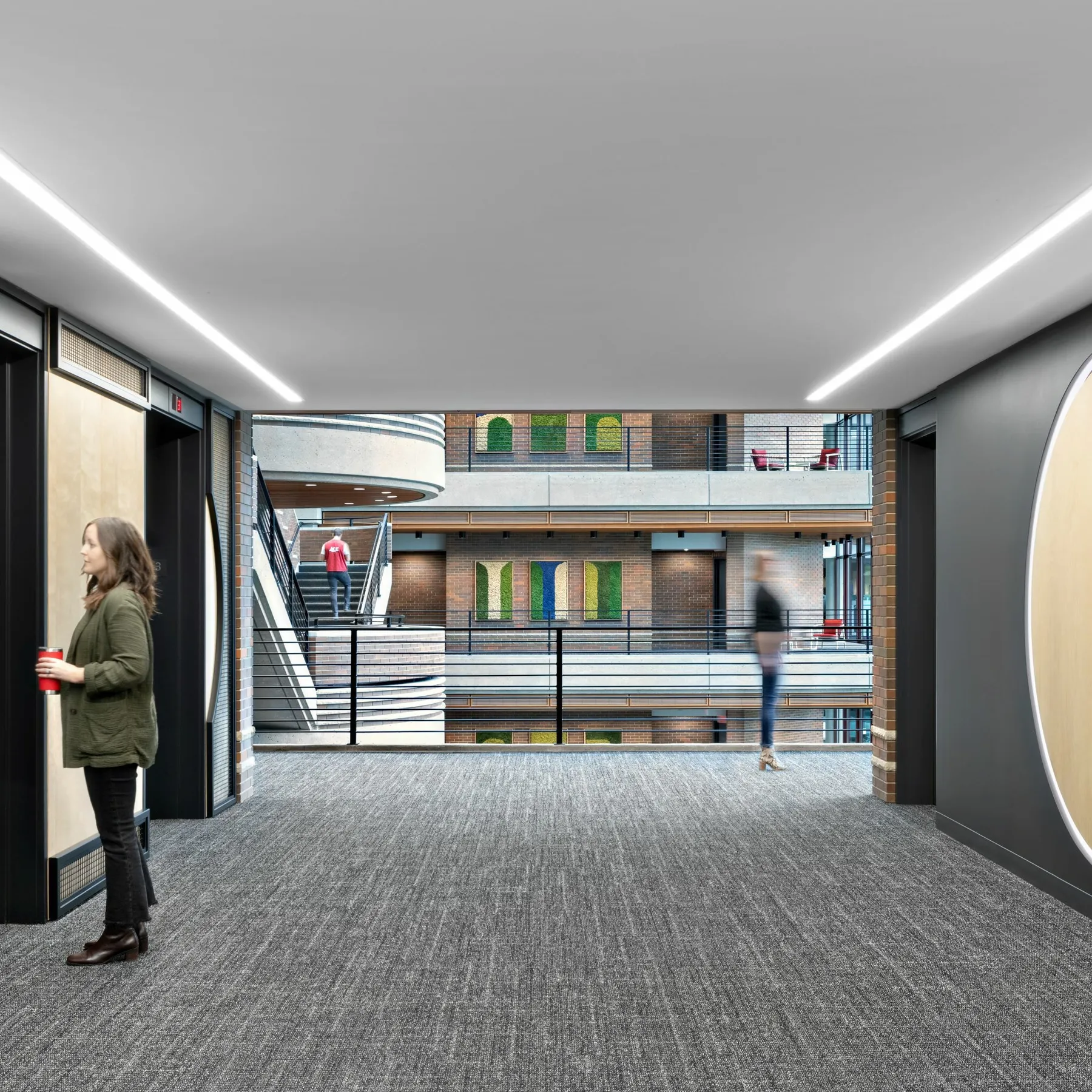 custom arched steel + wire mesh feature walls + bent steel pipe elevator signage by Icon Modern