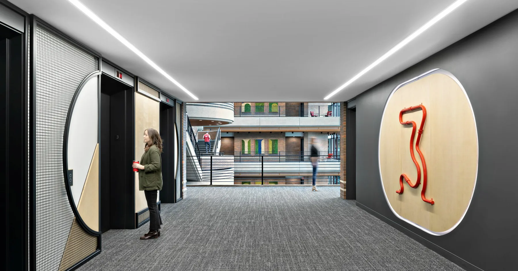 custom arched steel + wire mesh feature walls + bent steel pipe elevator signage by Icon Modern