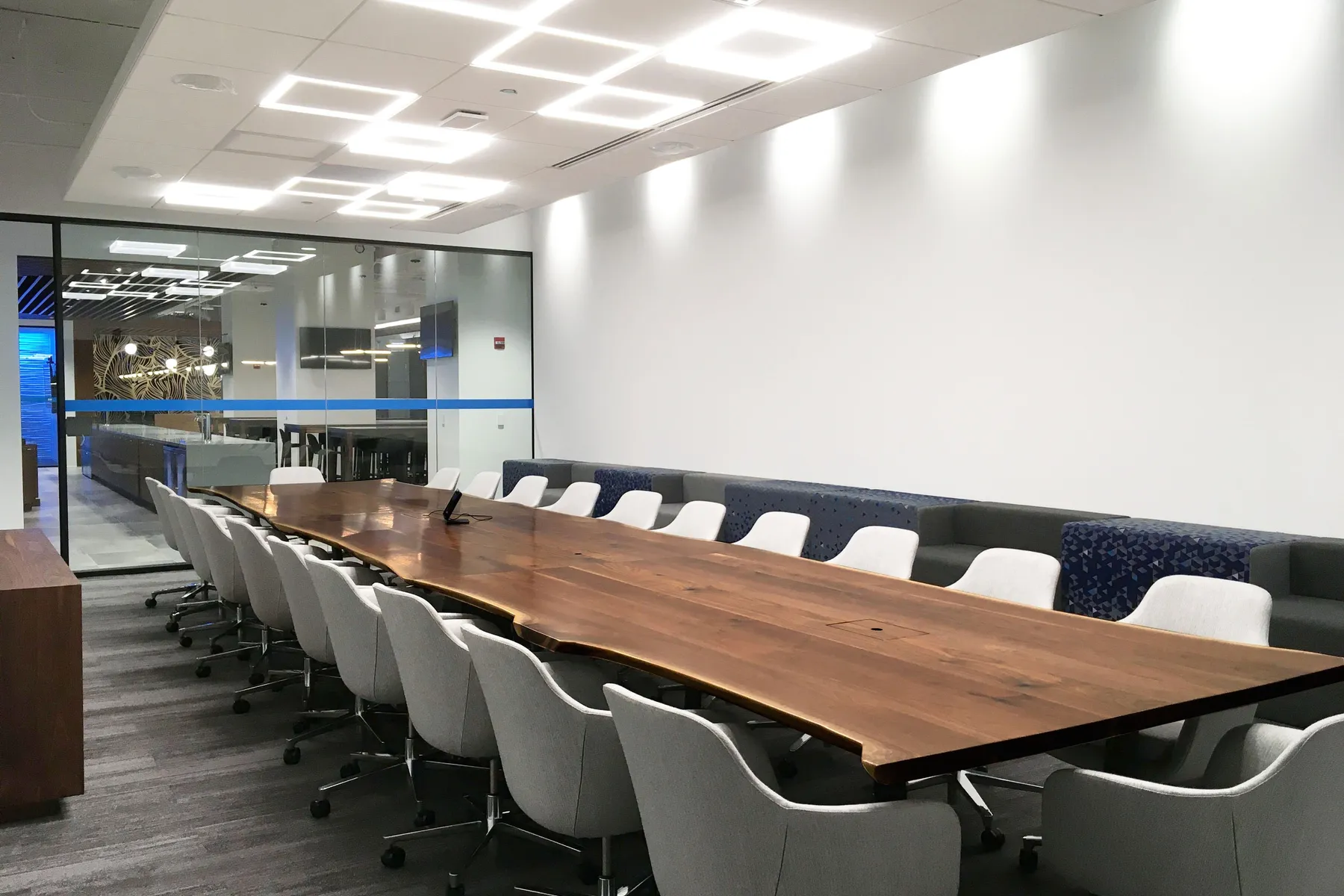 custom conference table in urban walnut live edge by Icon Modern